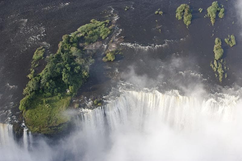 Gourmet dining on historic Livingstone Island, Victoria Falls Zambia