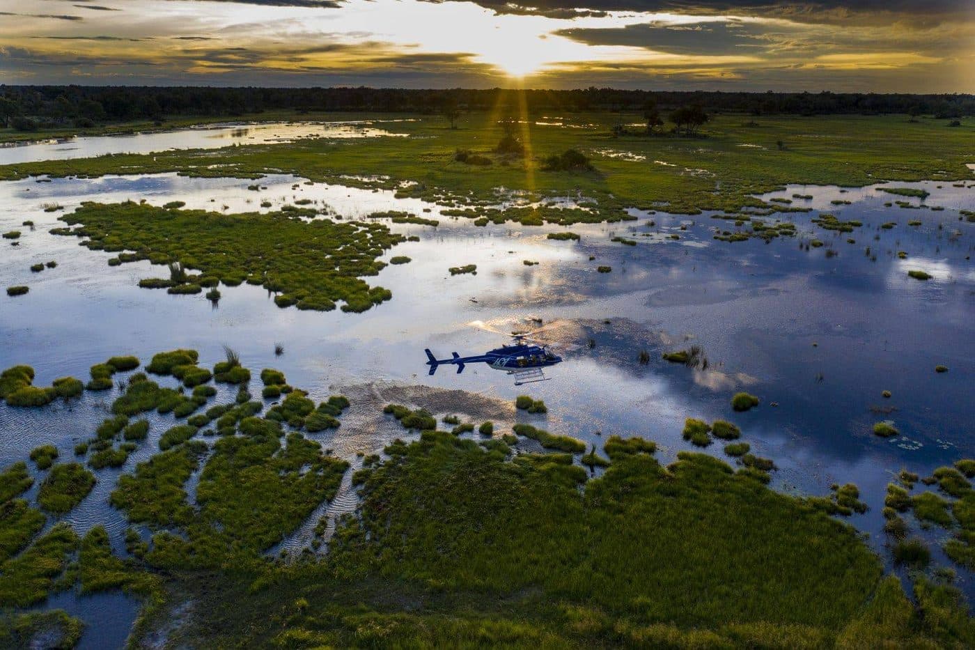 Doors-off helicopter flight over the Okavango Delta, Botswana