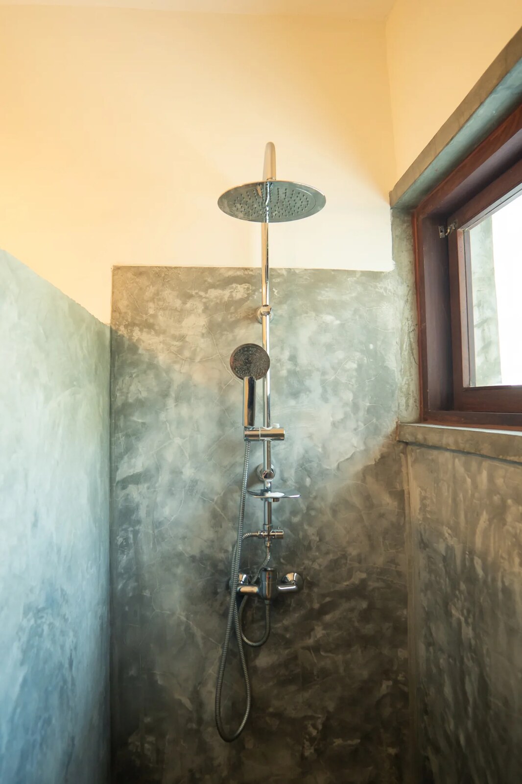 Stone outdoor shower in polished plaster at Duna Sonâmbula, Tofo, Mozambique