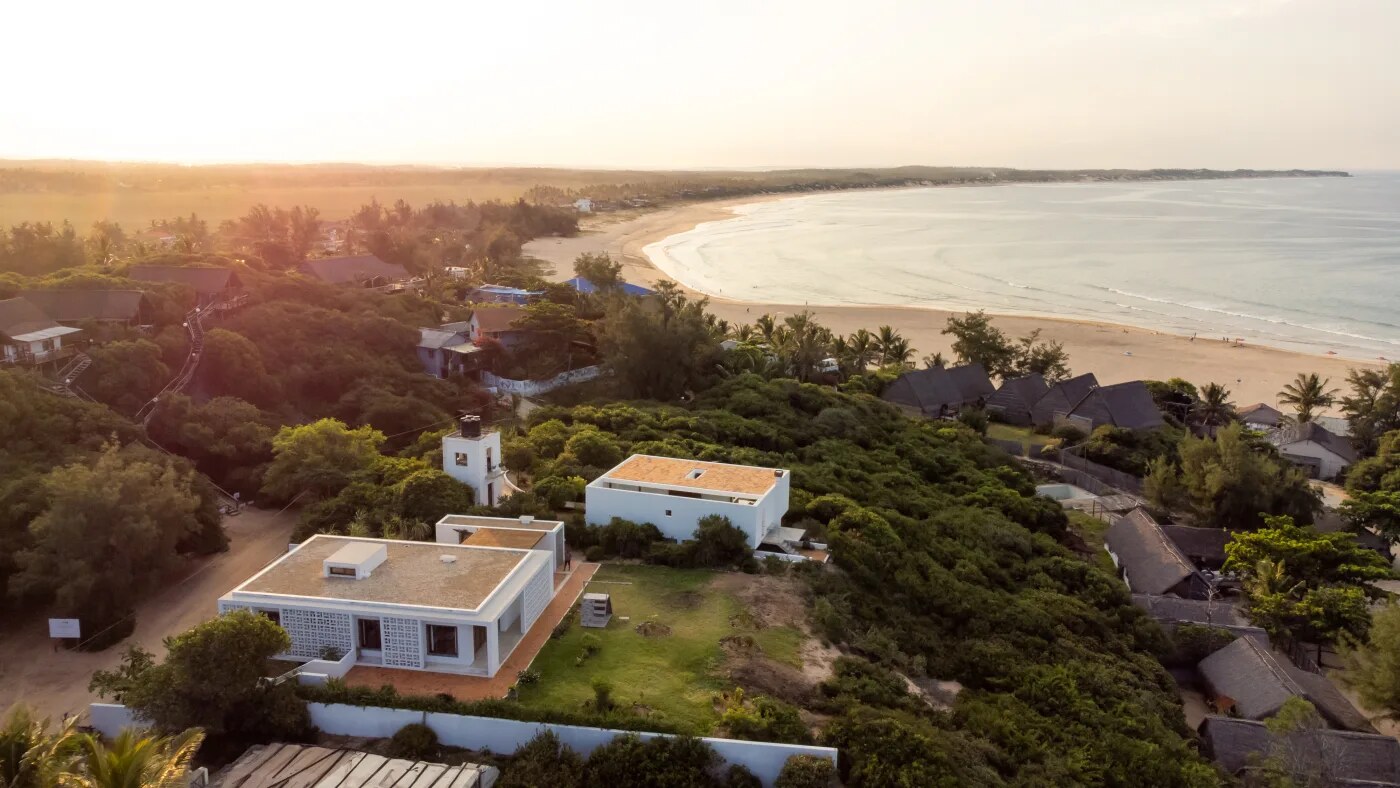 Golden-hour aerial view of the curve of Tofo Beach, Inhambane, Mozambique