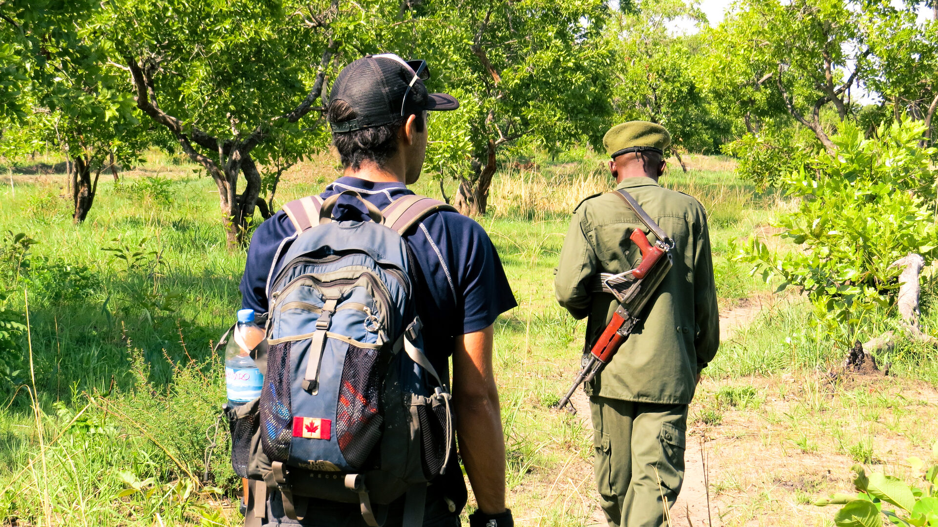 Guided walking safari in Tanzania — teenagers exploring Africa's wilderness on foot, the way it was meant to be experienced