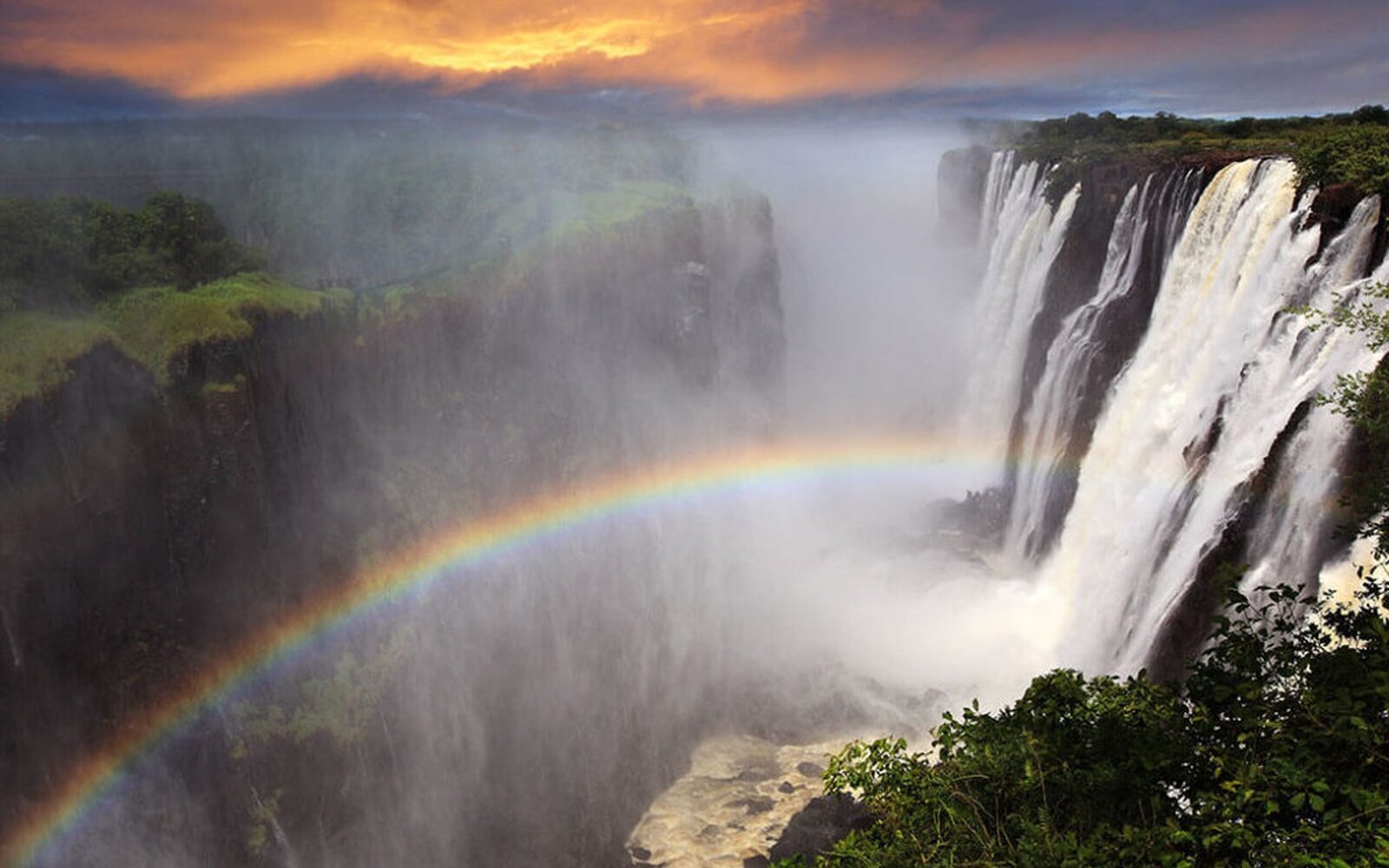 A rainbow arcing through the spray of Victoria Falls