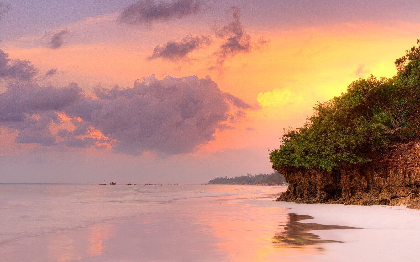 Traditional dhow sailing at sunset in Diani Beach lagoon