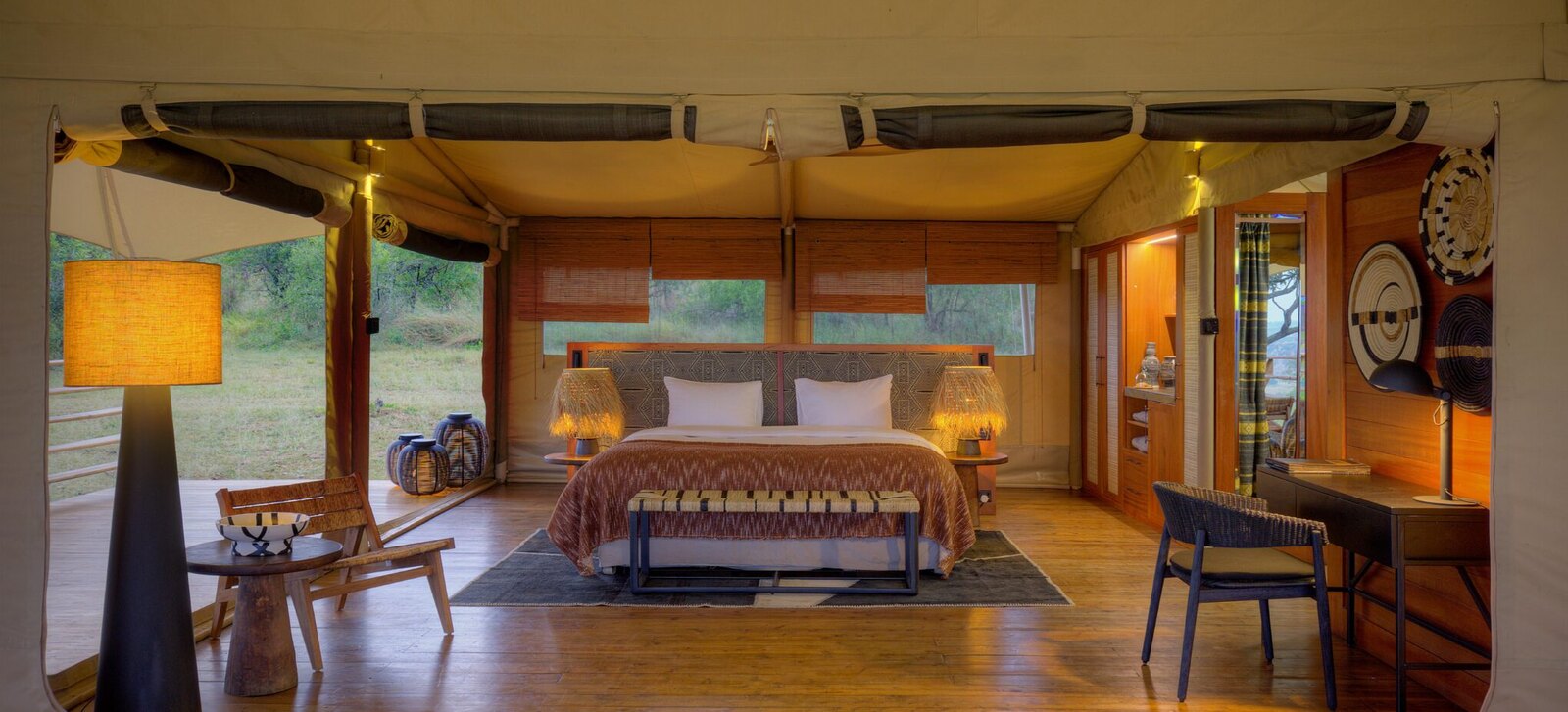 Accessible luxury lodge suite with private deck overlooking Serengeti plains and wildlife
