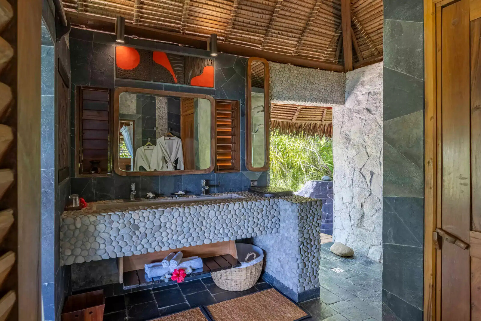 Ocean-view bedroom with billowing mosquito net and private deck at Time + Tide Tsara Komba, Nosy Komba, Madagascar