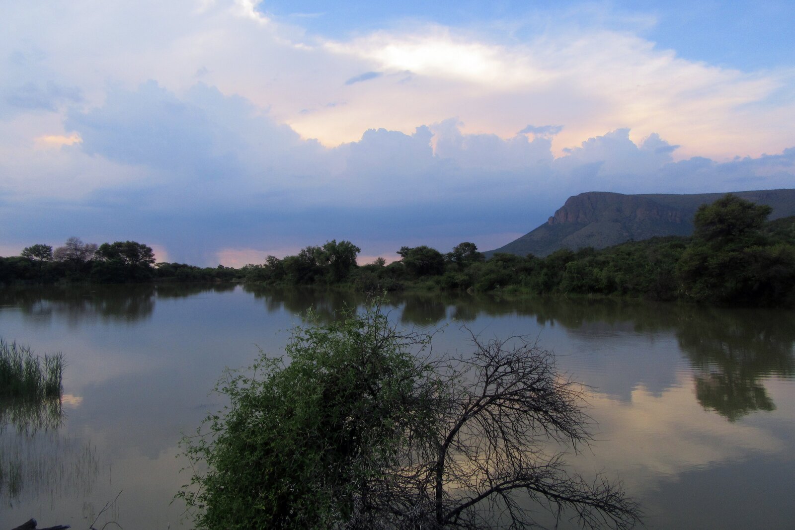 A wild bush camp beside the Save River at dusk in Zinave National Park, Mozambique