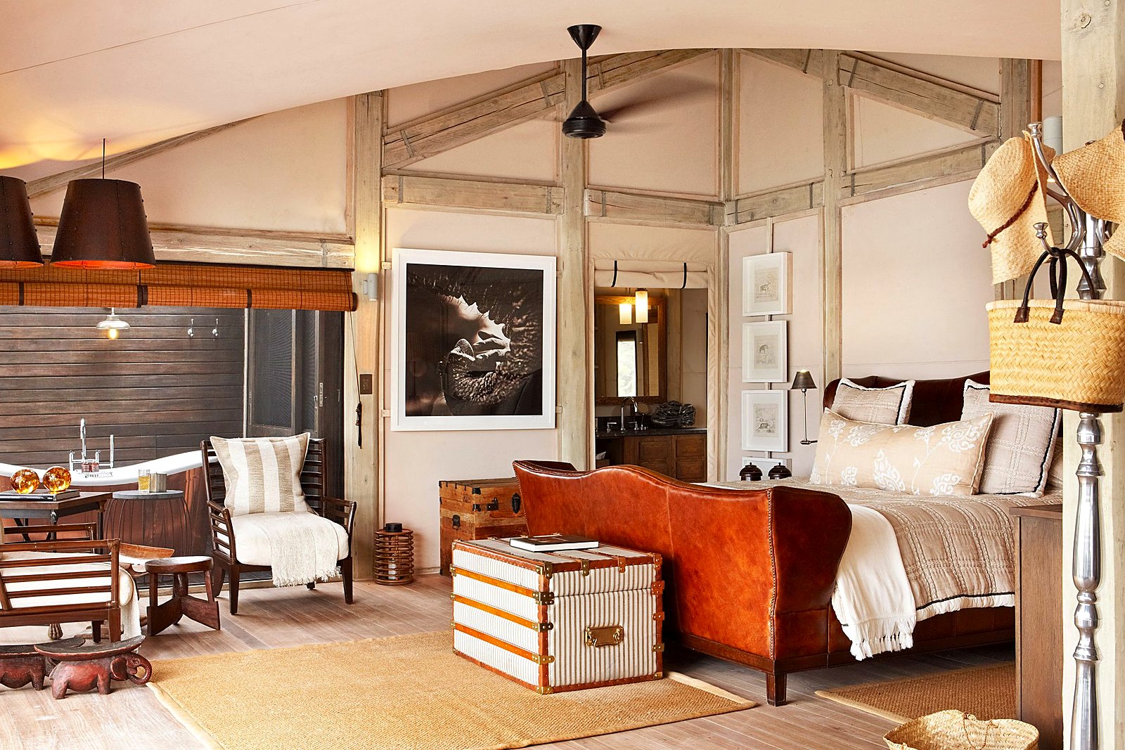 Suite bedroom in hardwood and neutral canvas at Abu Camp