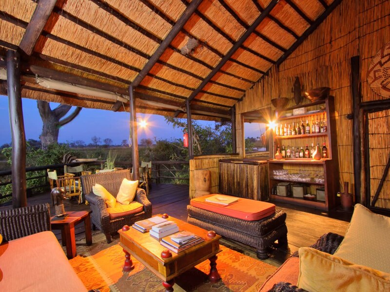 Open-sided thatched lounge at Delta Camp overlooking the permanent water channels