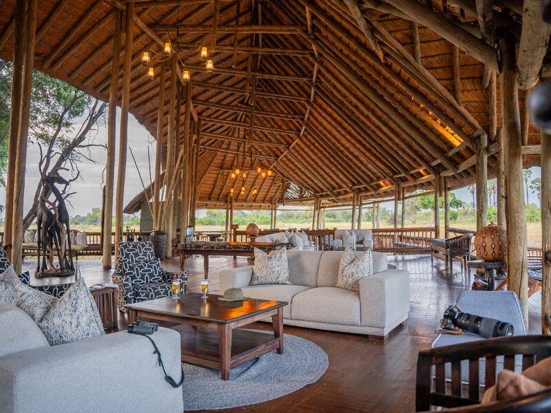 Thatched main lounge and dining area at Moremi Crossing overlooking the floodplain