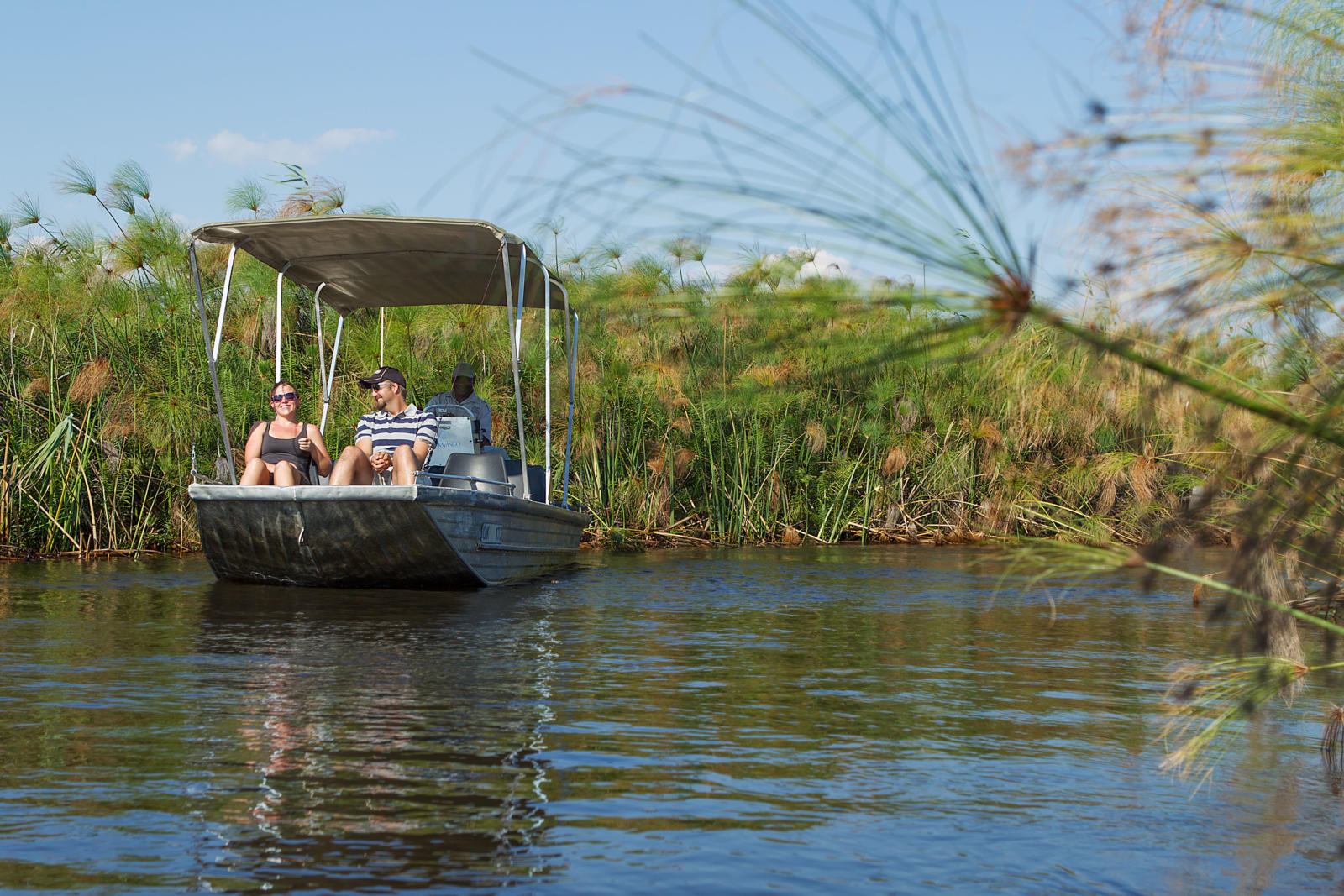 A motorboat safari through the channels of the permanent Okavango Delta at Camp Okavango