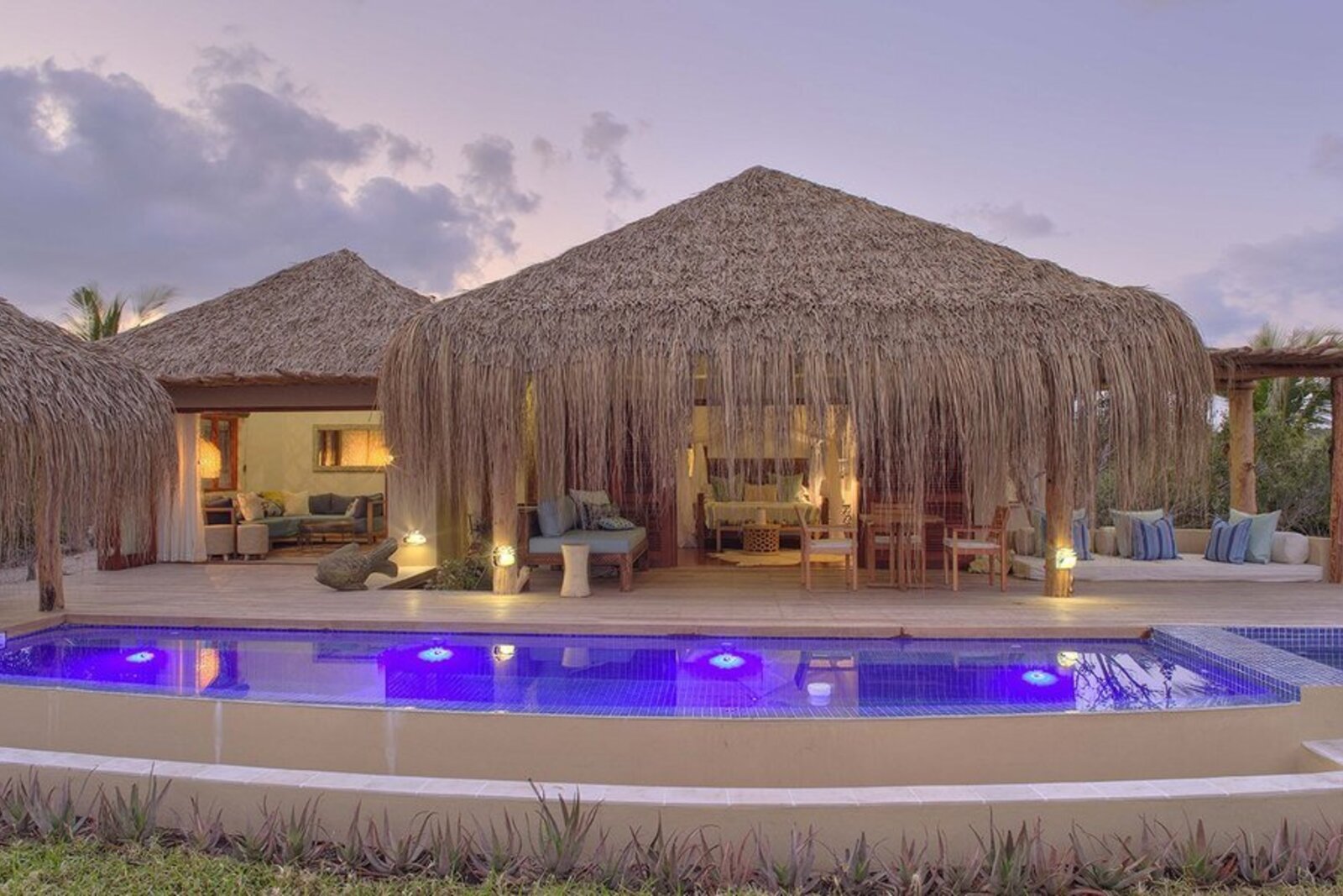 A barefoot-luxury beach setting with a private lounger at an Indian Ocean honeymoon retreat