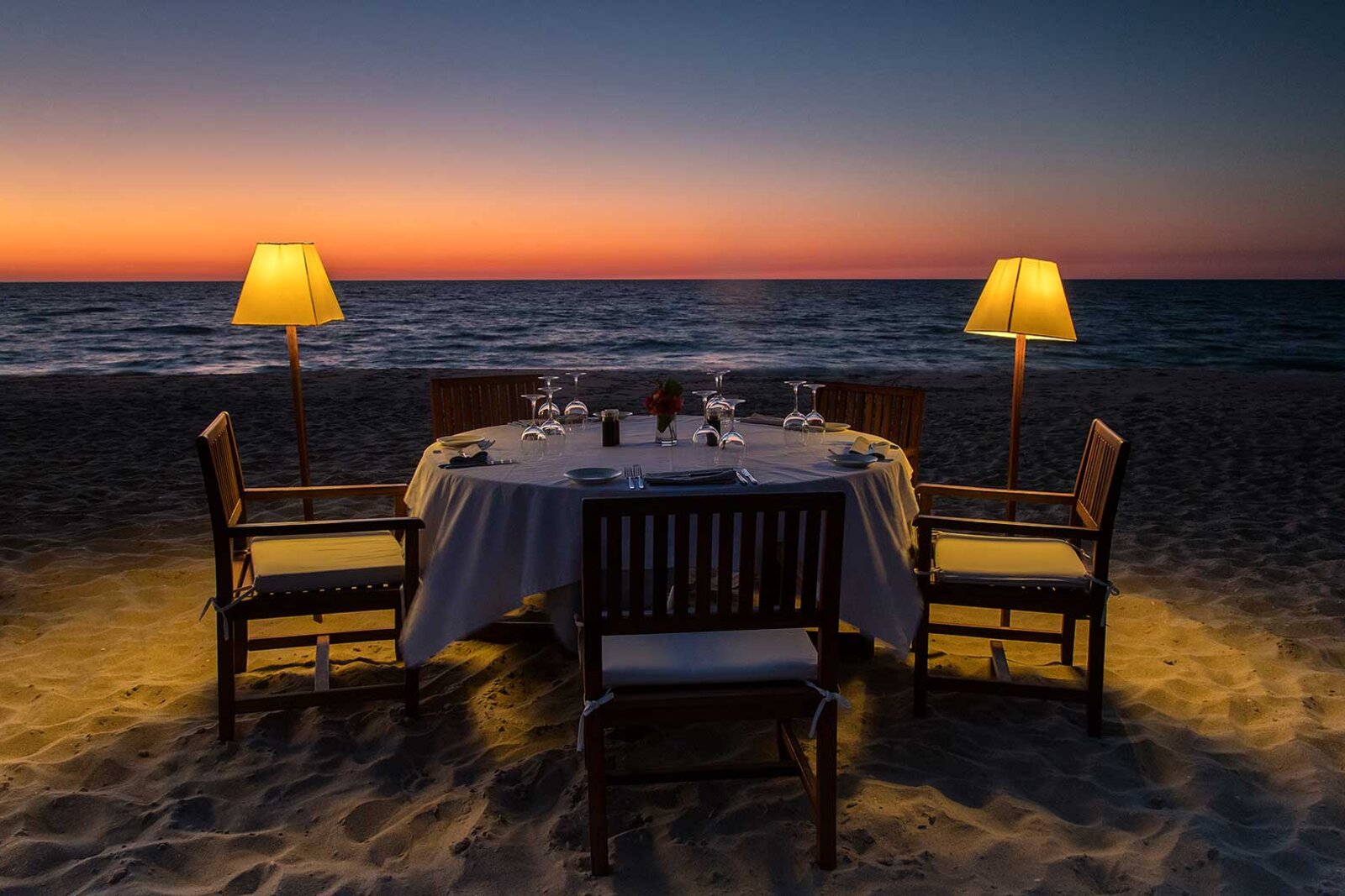 A romantic private beach dinner at sunset at Anjajavy le Lodge