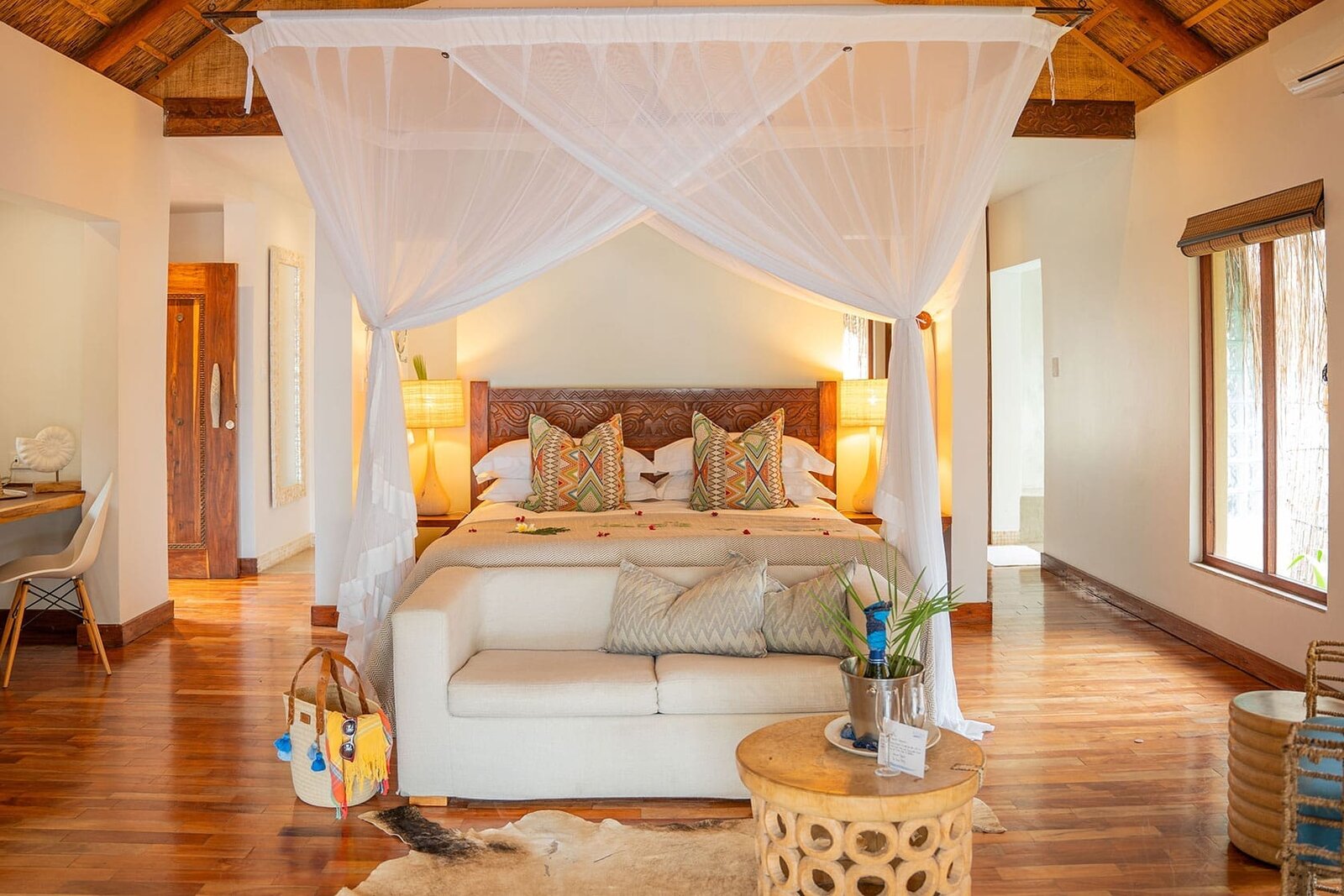 A beach villa bedroom at Azura Benguerra opening to the Indian Ocean, Bazaruto Archipelago, Mozambique