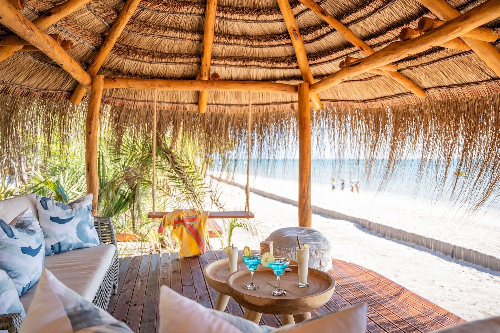 A private villa deck with daybed and plunge pool overlooking the beach at Azura Benguerra, Mozambique