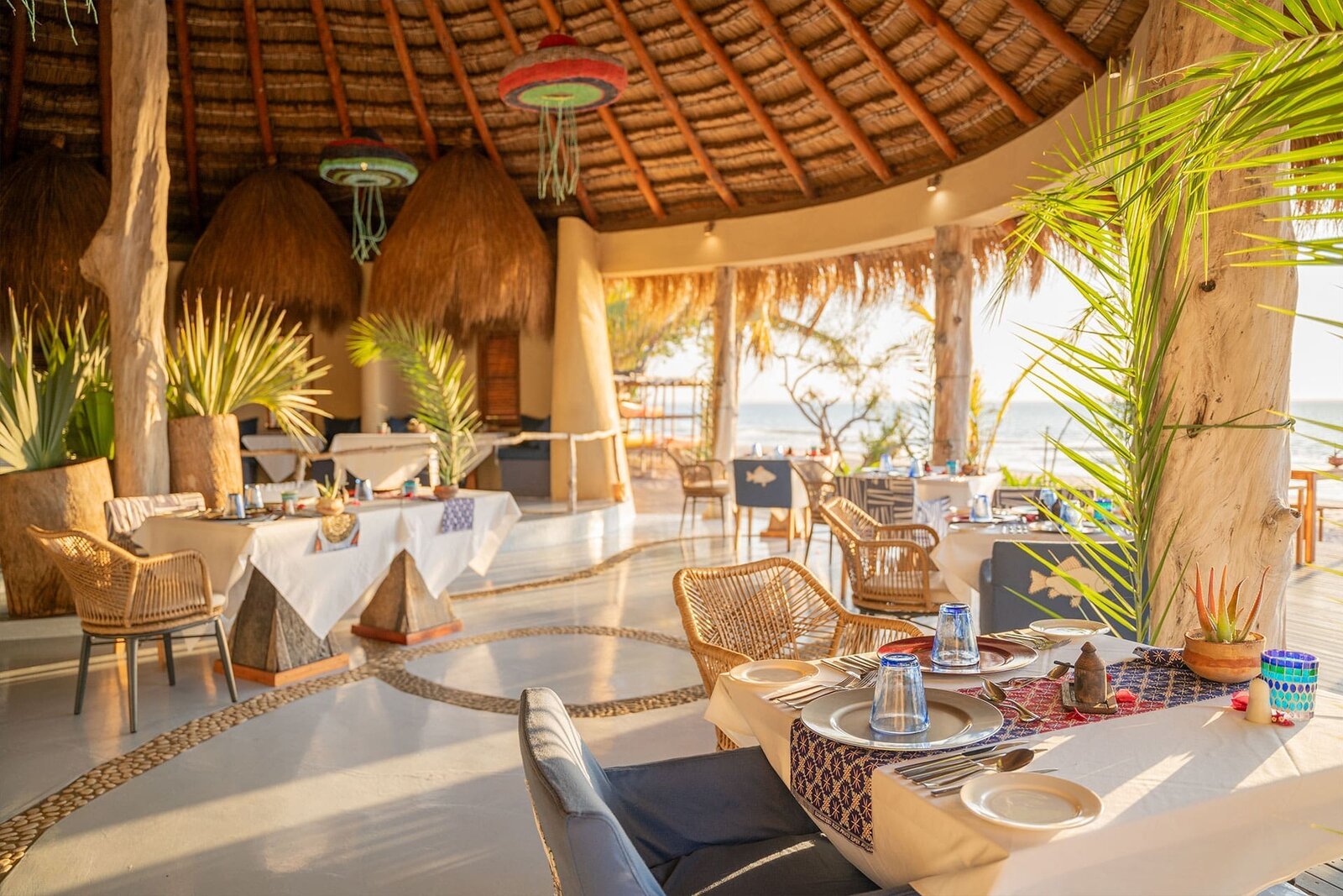 The open-sided restaurant pavilion at Azura Benguerra overlooking the beach and ocean, Mozambique