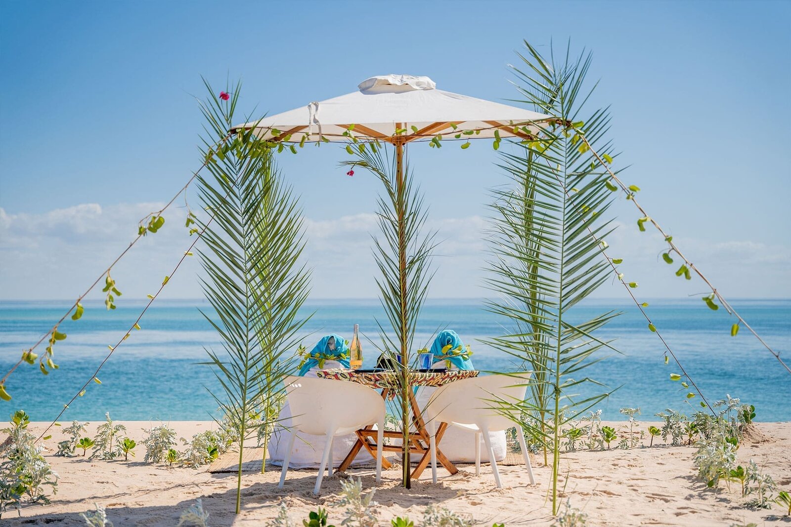 A private beach gazebo set for dining on the sand at Azura Benguerra, Bazaruto Archipelago, Mozambique