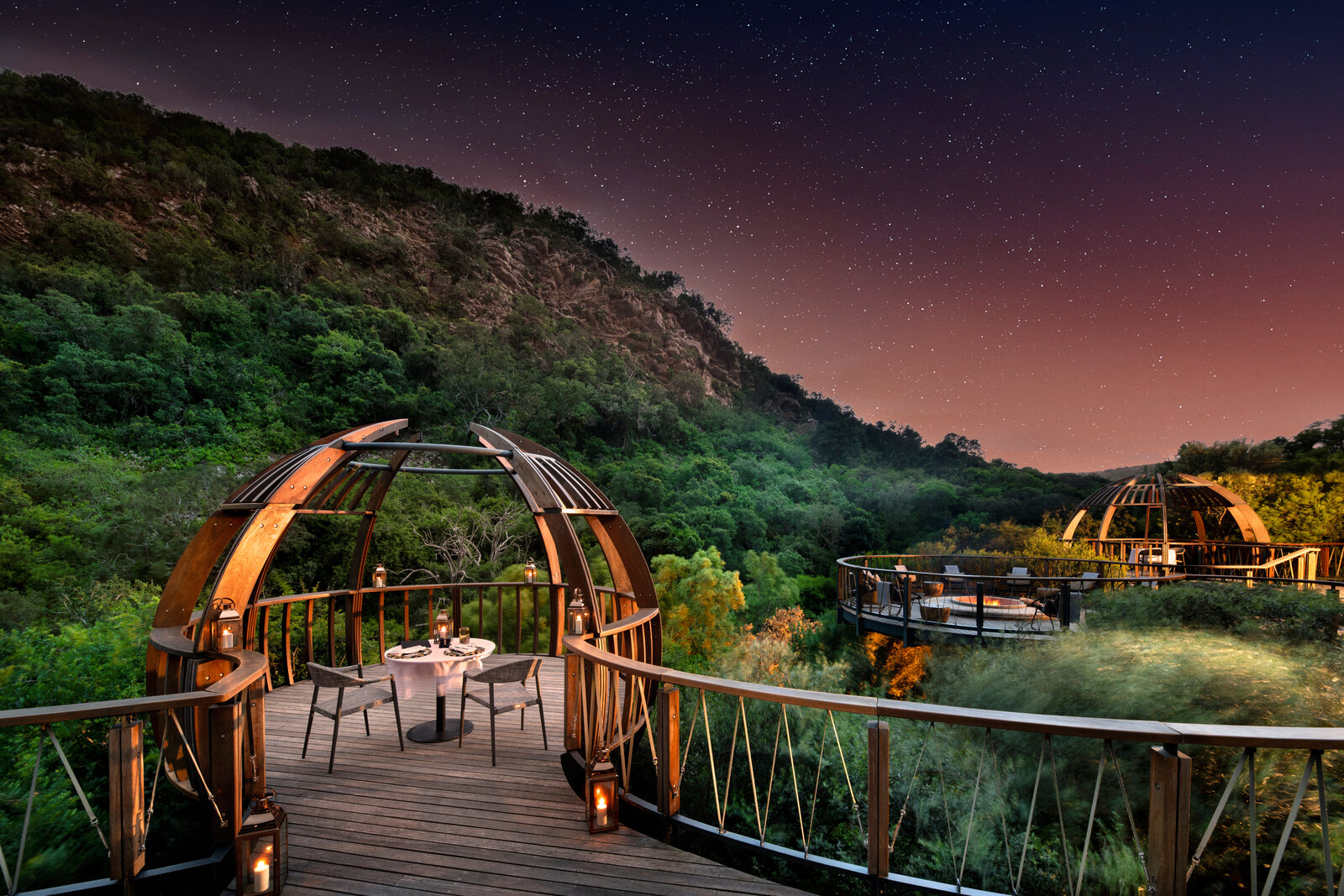 A private deck at Shamwari Eagles Crag at dusk overlooking the Eastern Cape bush