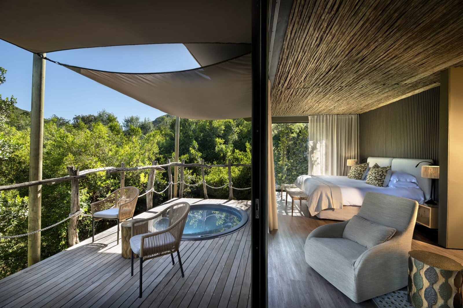 A luxurious four-poster tented suite at Shamwari Bayethe