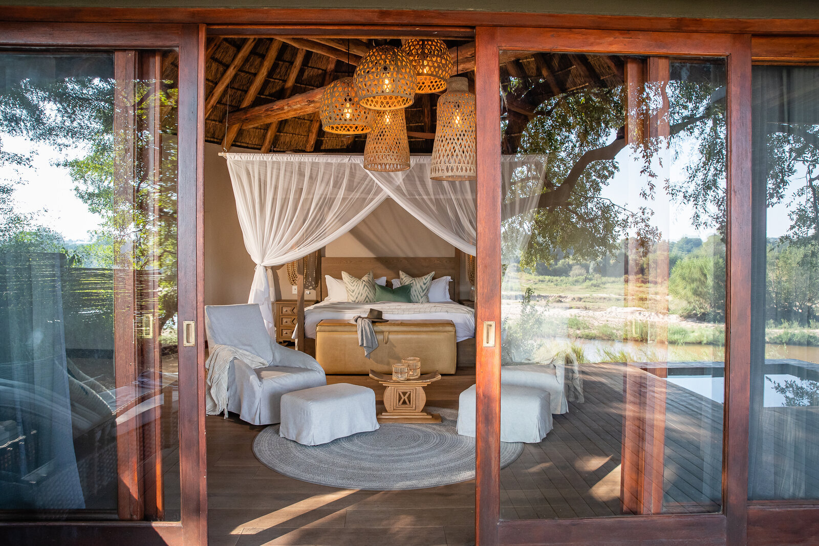 An intimate suite with a canopy bed at Dulini Little Bush Camp in the Sabi Sand
