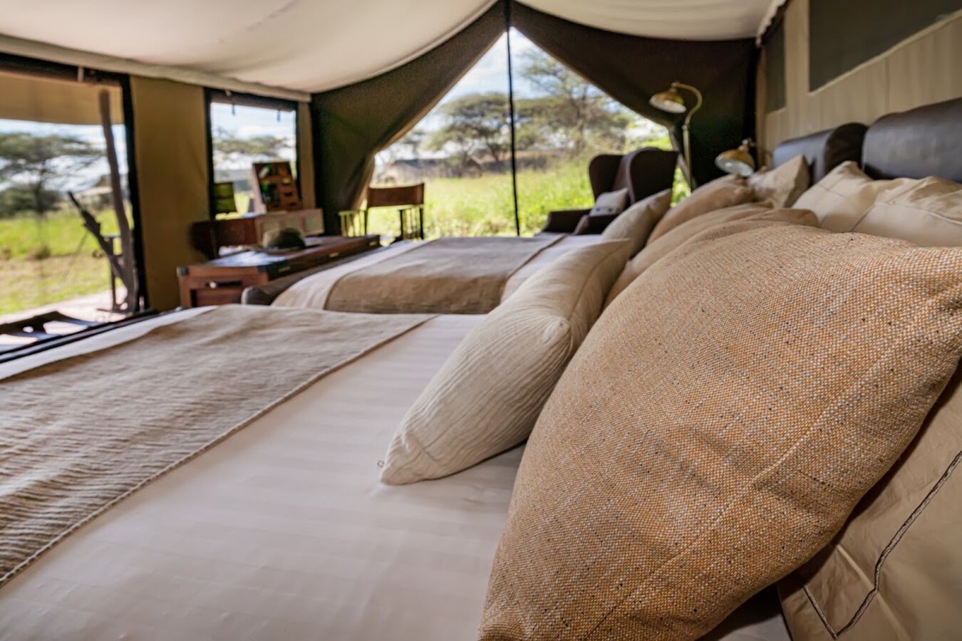 Lemala Ewanjan Tented Camp elegant tent interior with en-suite bathroom