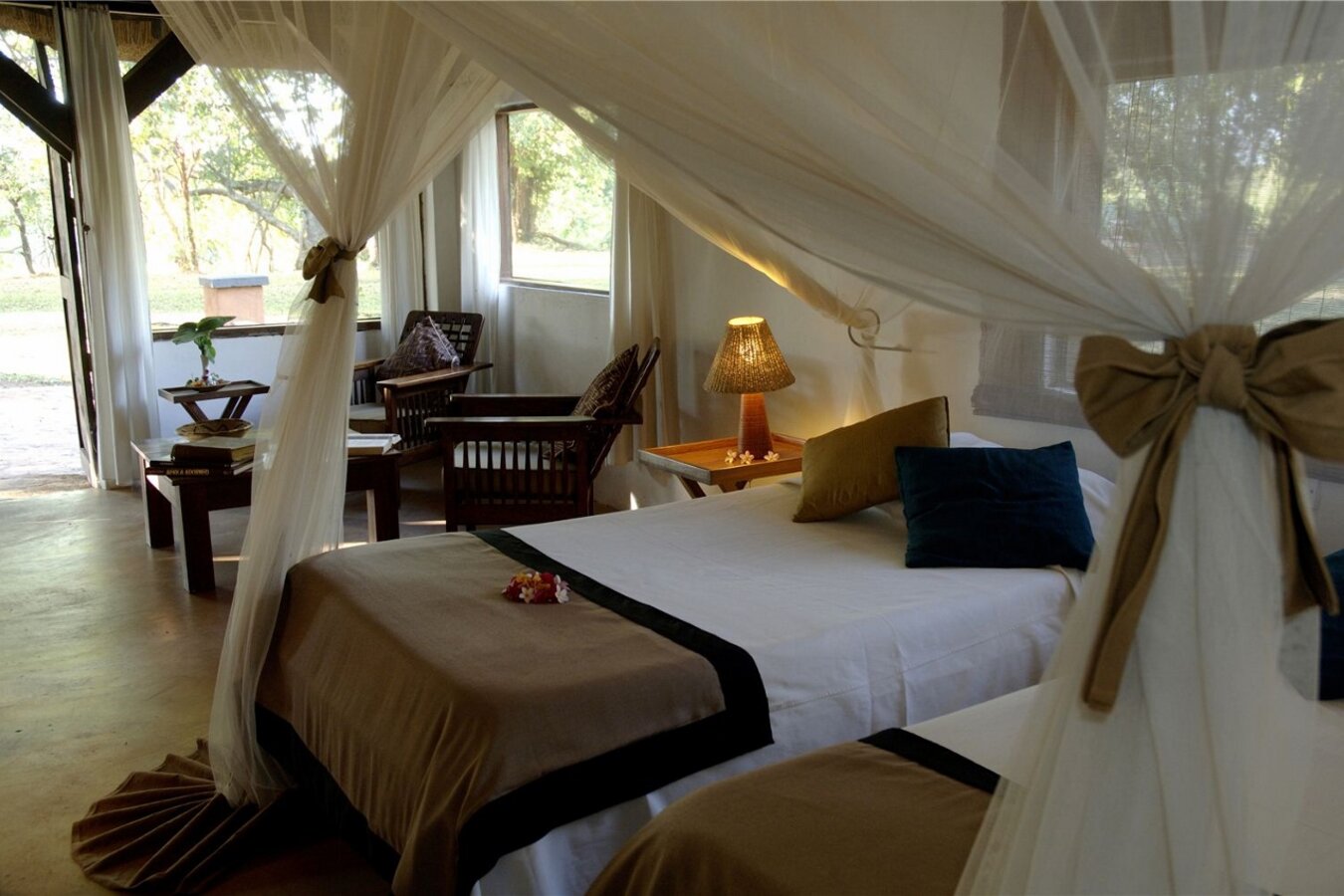 Kapani Lodge thatched chalets at golden hour in South Luangwa