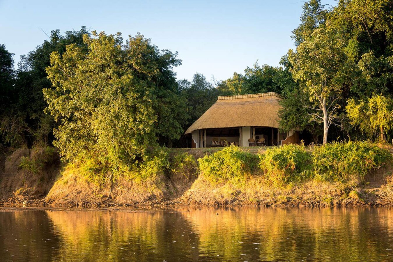 Nkwali Camp sundowners on the Luangwa River bank