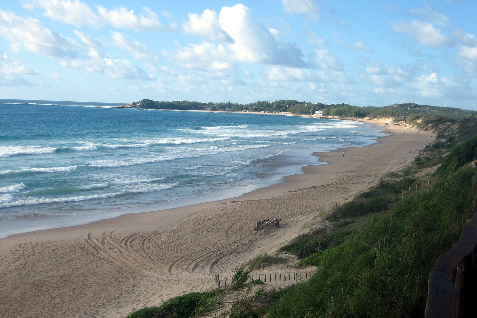 The wide golden beach and rolling surf at Tofo, Inhambane, Mozambique