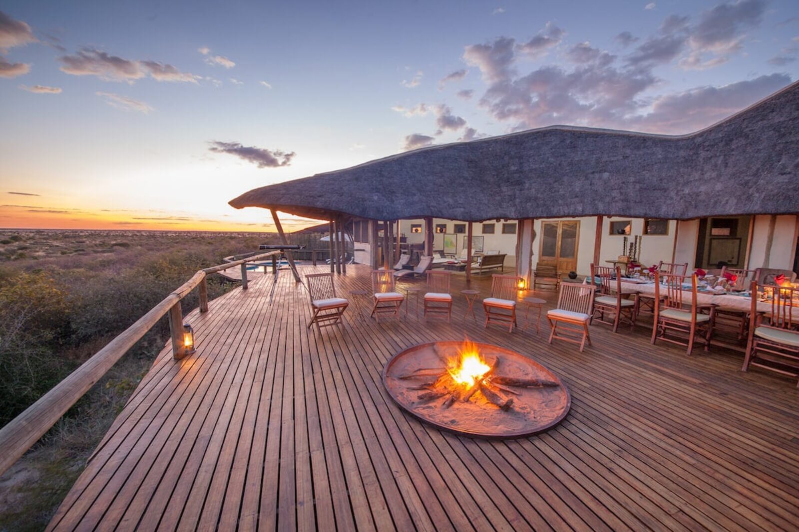 Raised main deck of Tau Pan Camp over the Kalahari pan at golden hour