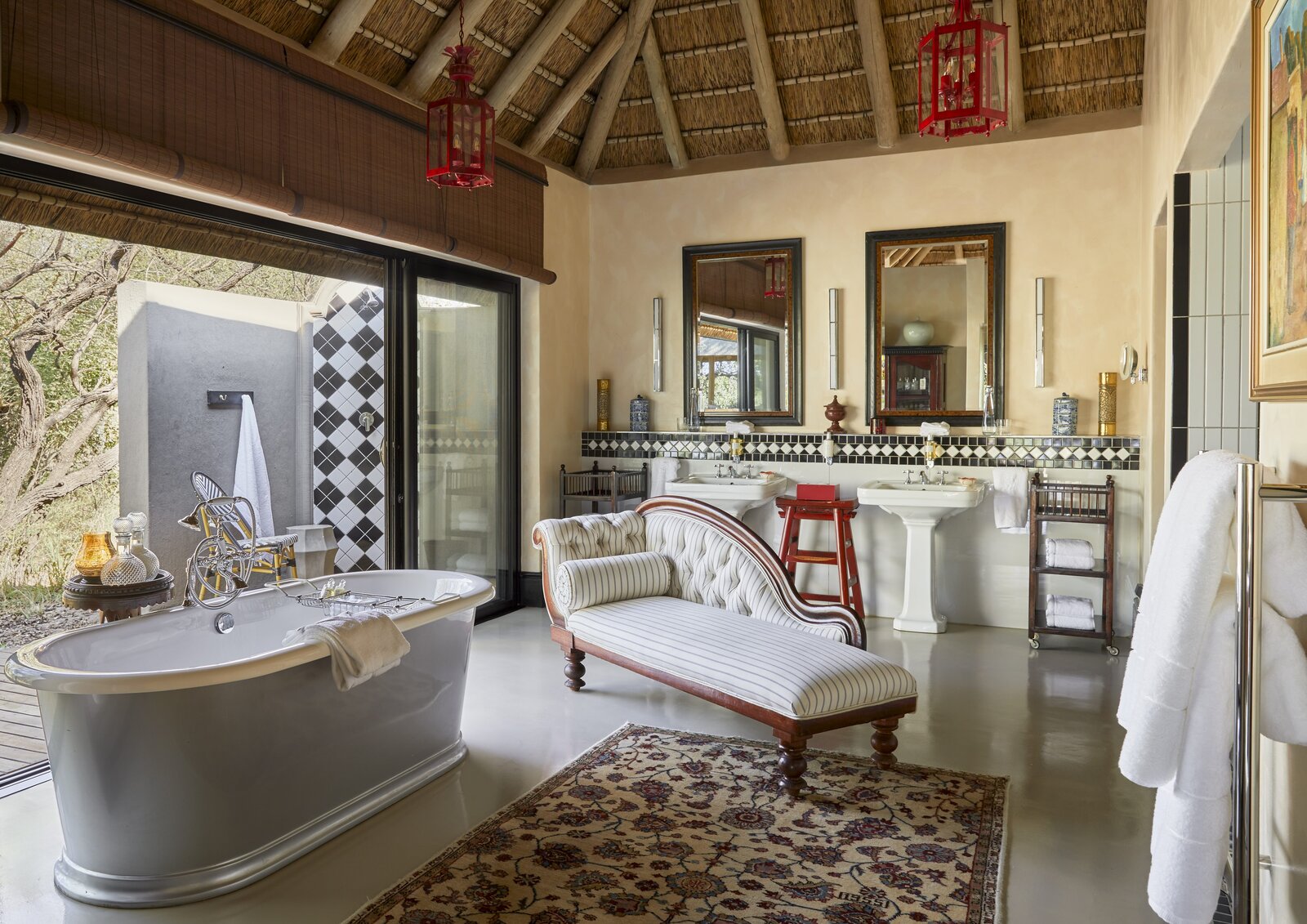 A royal suite interior with a freestanding bath on a luxury couples safari in Africa