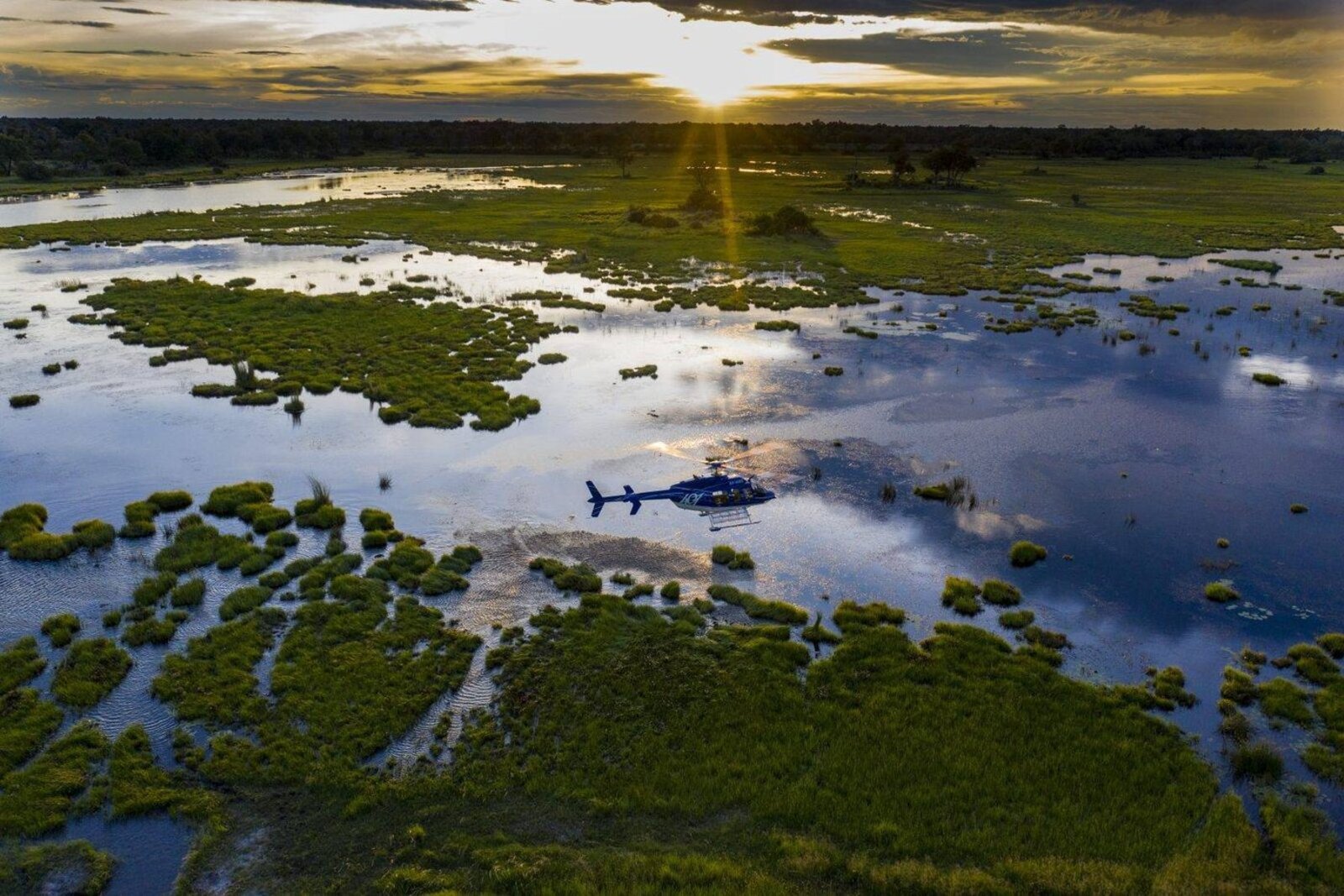 A helicopter scenic flight over the Okavango Delta floodplains on a luxury couples safari