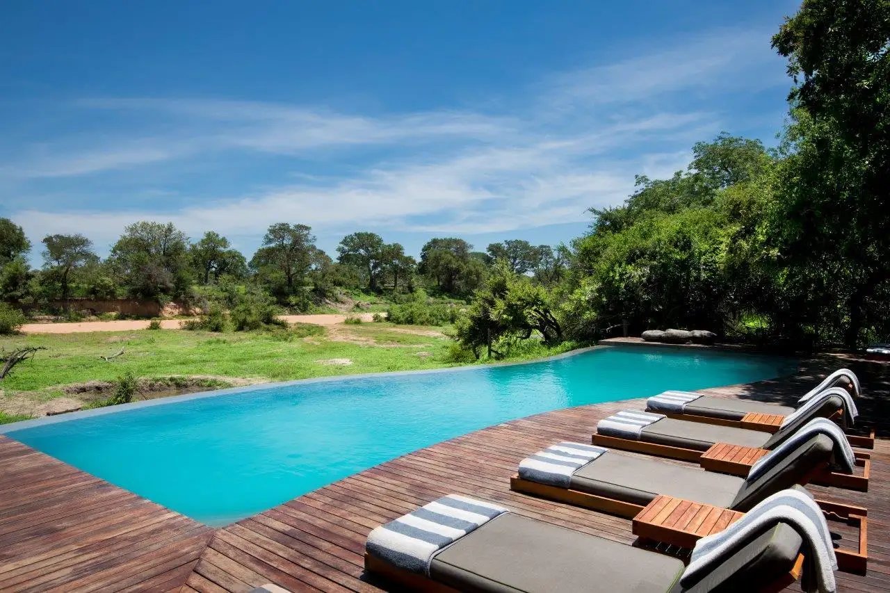 A contemporary luxury tented suite with outdoor shower at &Beyond Ngala in the Timbavati