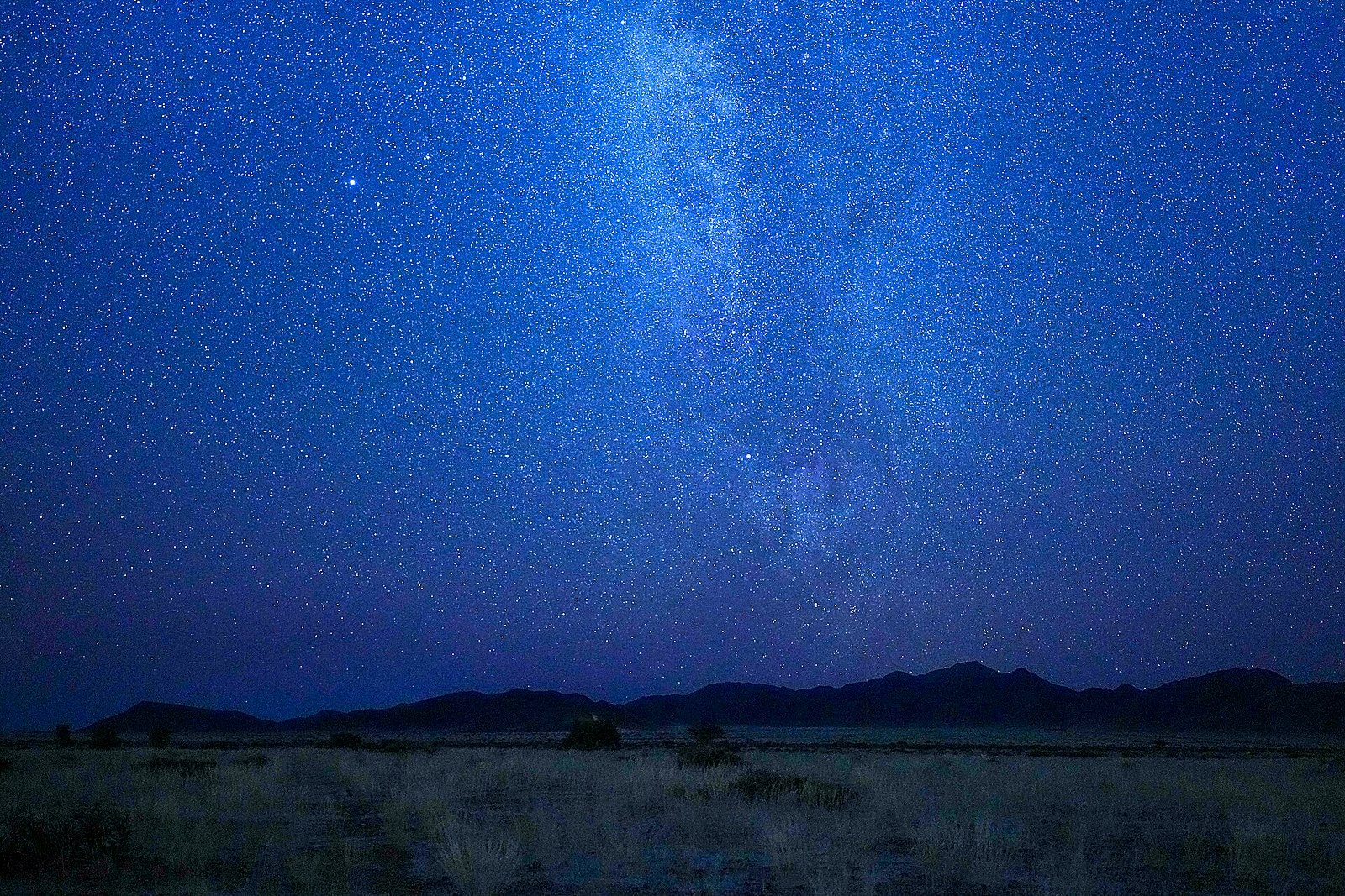 The Milky Way blazing over the Namib Desert on a Namibia honeymoon safari package