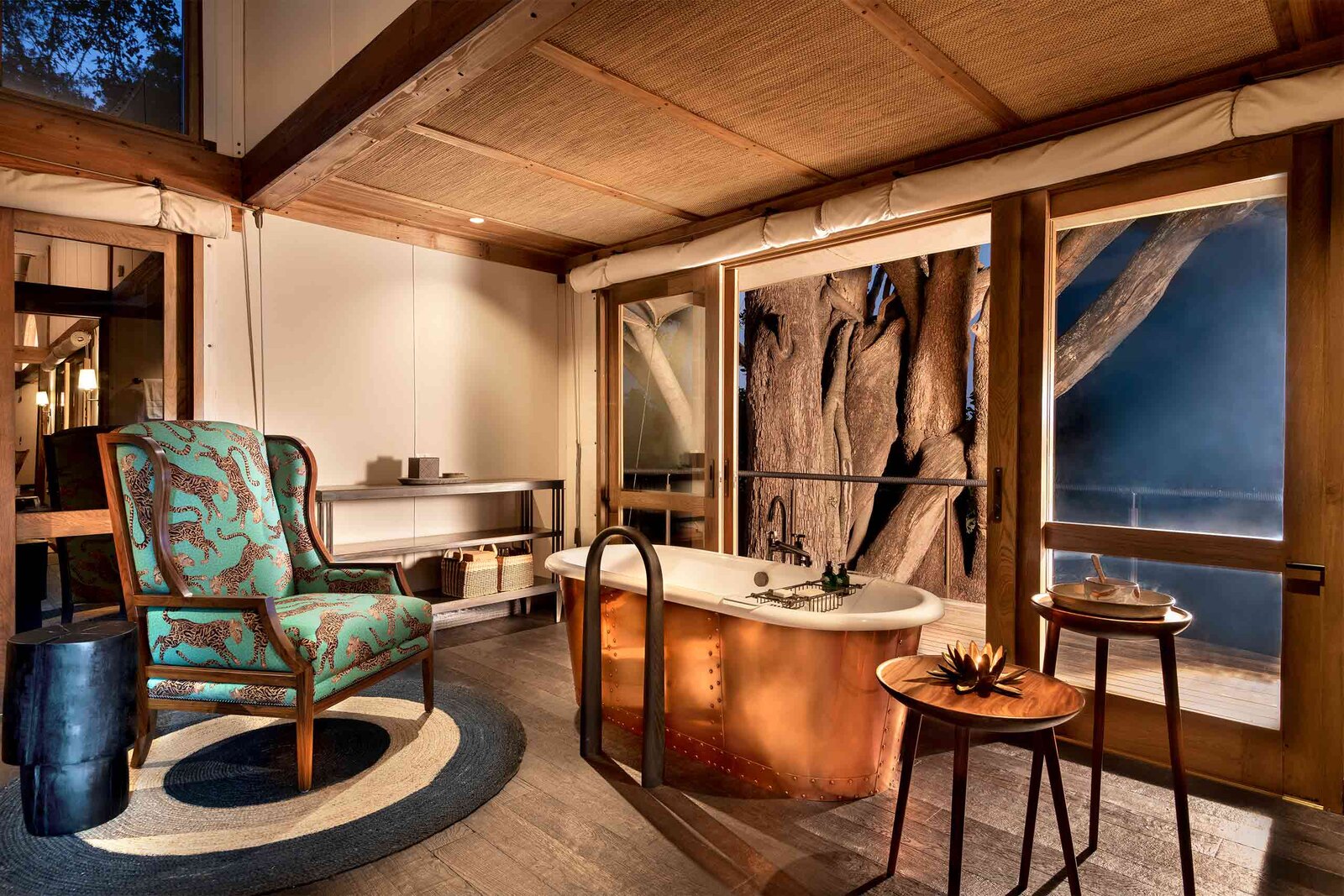 The art-filled suite lounge with copper bath at Xigera Safari Lodge in the Okavango Delta