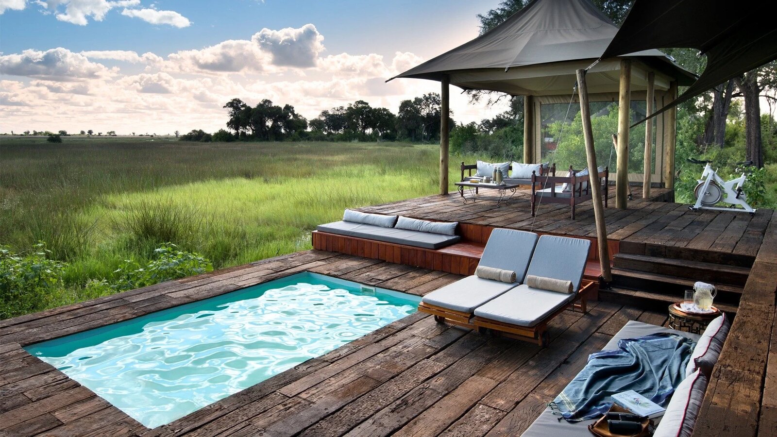 A guest tent exterior deck and plunge pool at Duba Plains Camp in the Okavango Delta