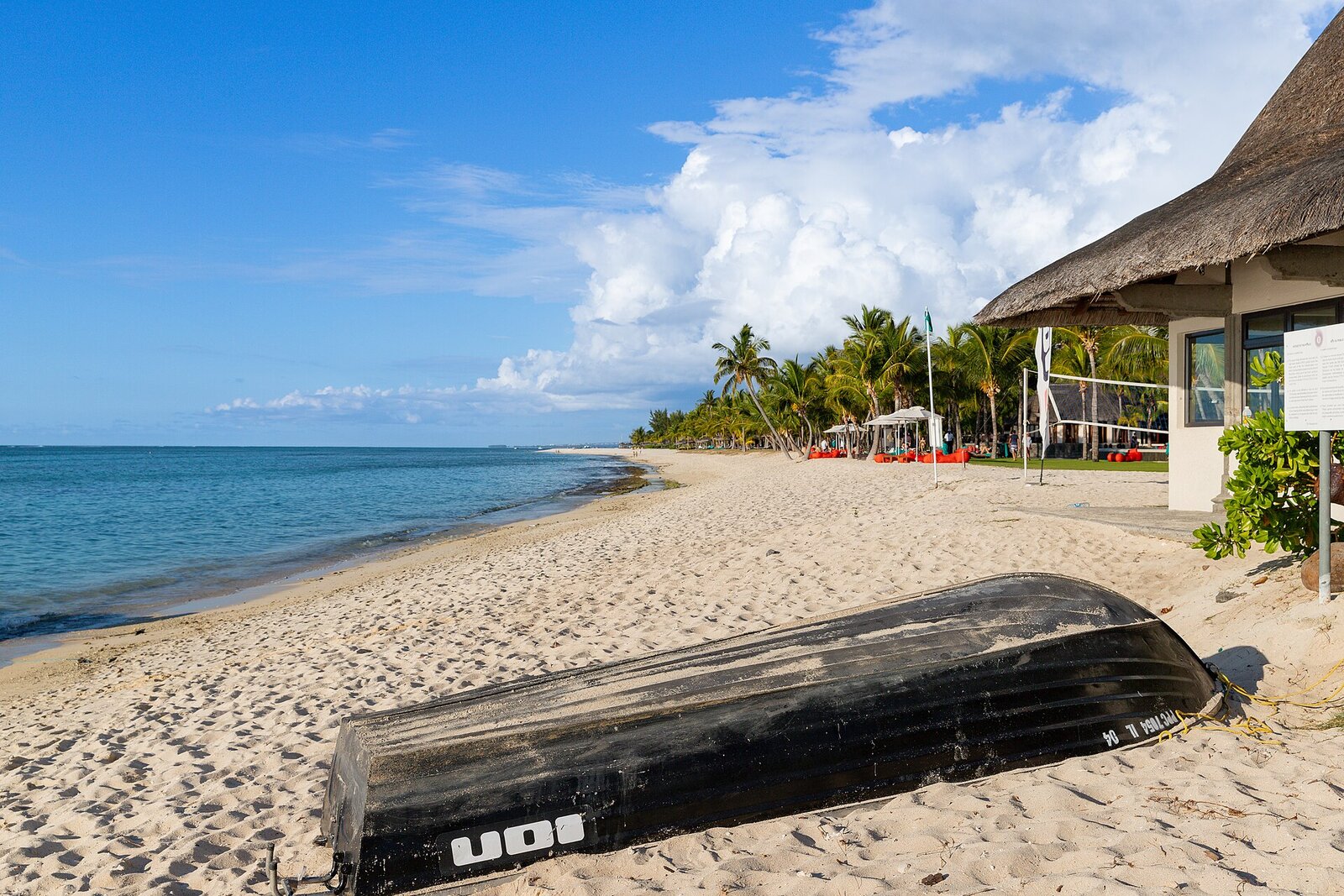White-sand beach and turquoise lagoon beneath Le Morne Brabant mountain, Mauritius — the dry winter from May to December is the best time to visit