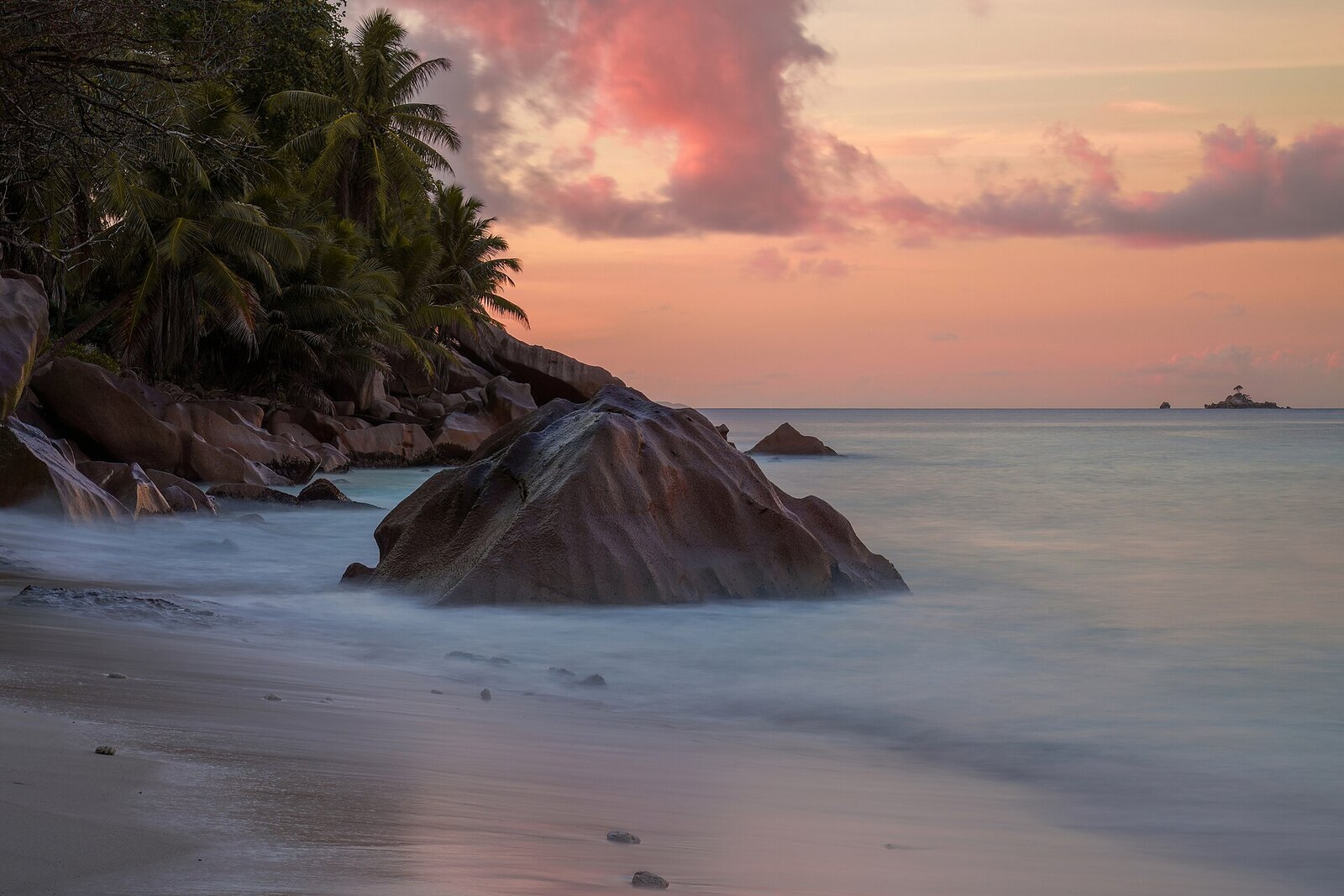 A warm sunset over a calm Seychelles beach