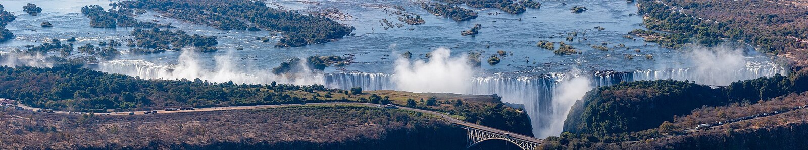 Victoria Falls at full flood — the entire 1,708-metre curtain of the Zambezi thundering into the Batoka Gorge