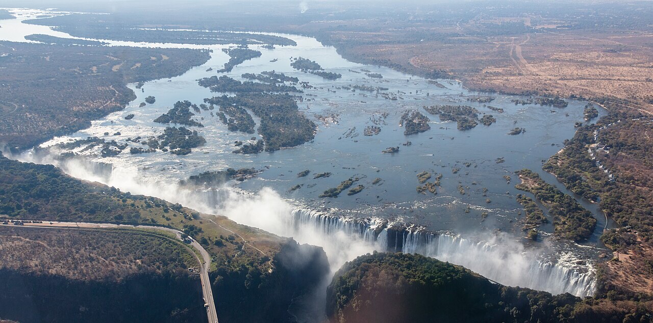 Spray-born rainbow above the Victoria Falls gorge during high-water season