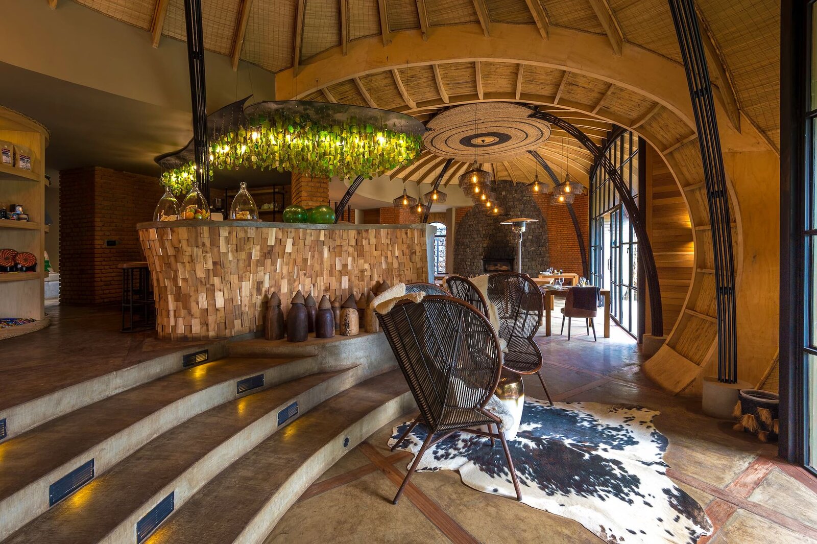 The woven, domed main lounge and bar at Bisate Lodge with organic Rwandan craft