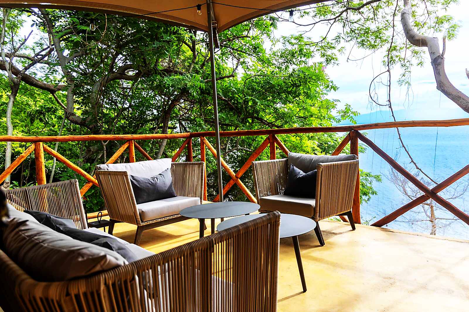 A shaded deck lounge overlooking Lake Malawi from Blue Zebra Island Lodge