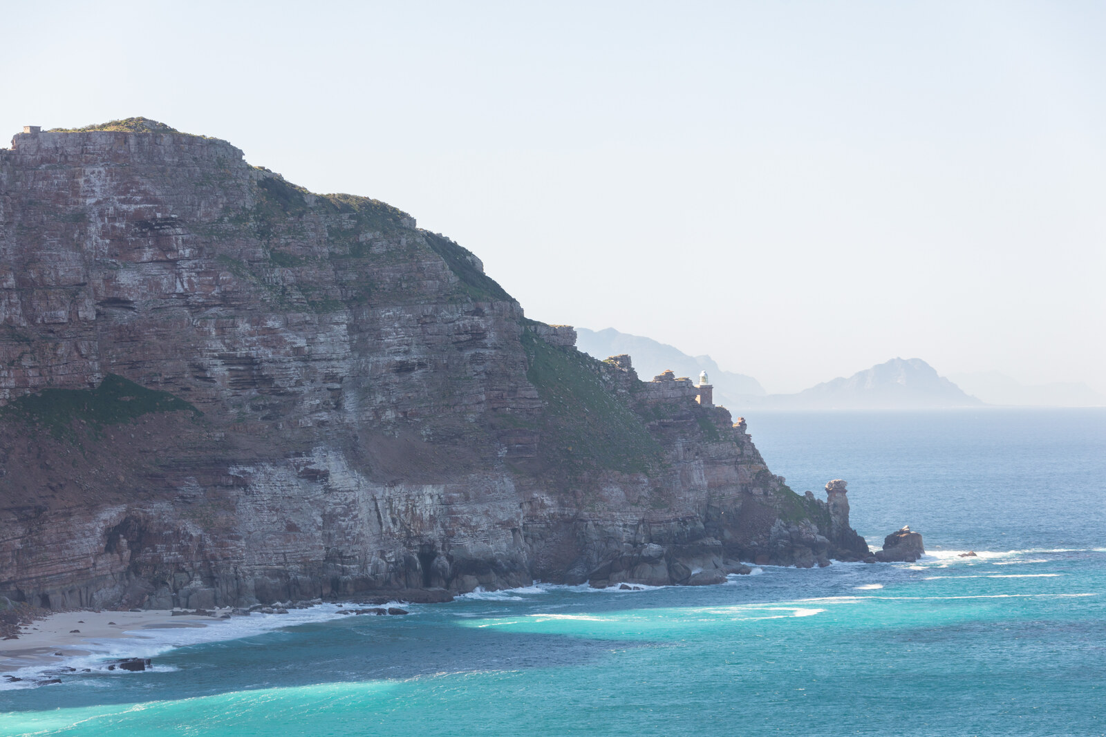 The dramatic cliffs of the Cape of Good Hope plunging into turquoise water