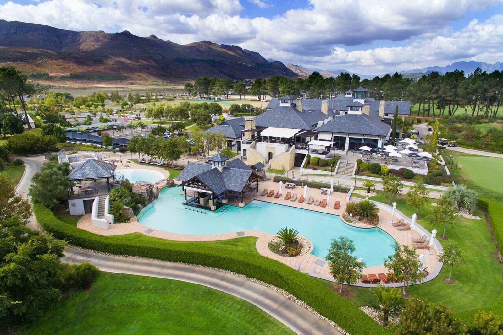 Luxury estate pool set among vineyards with mountain views