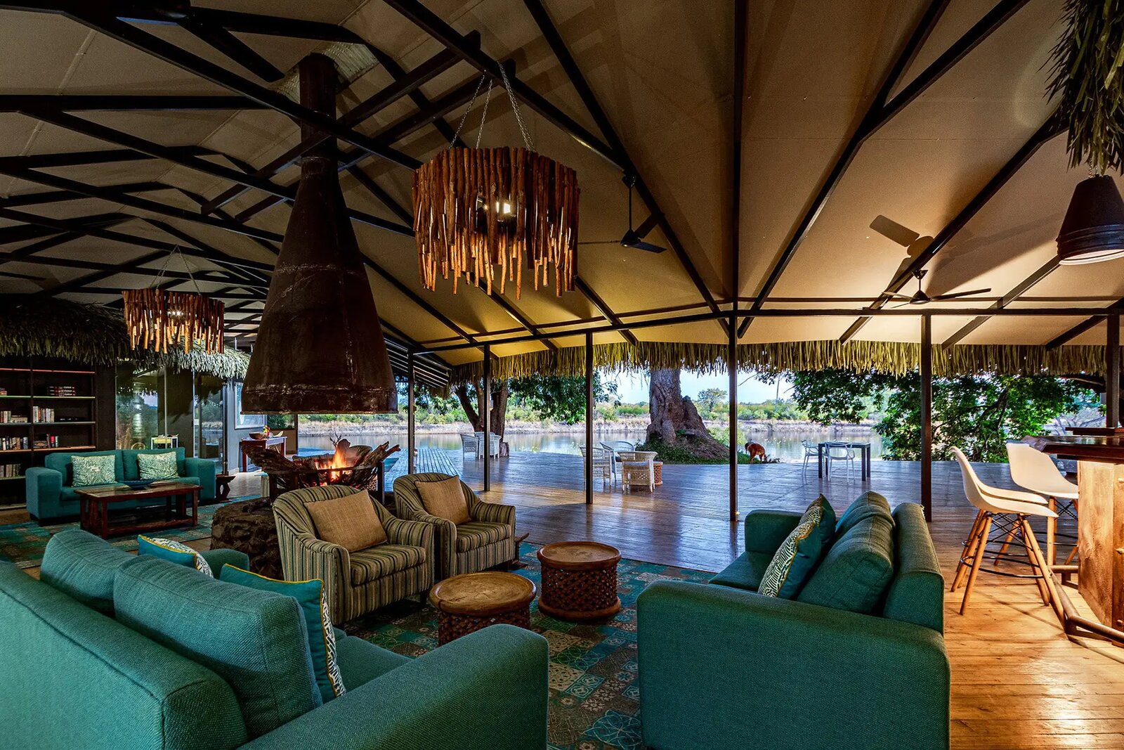 The open-plan lounge and bar at Chundu Island looking over the Zambezi