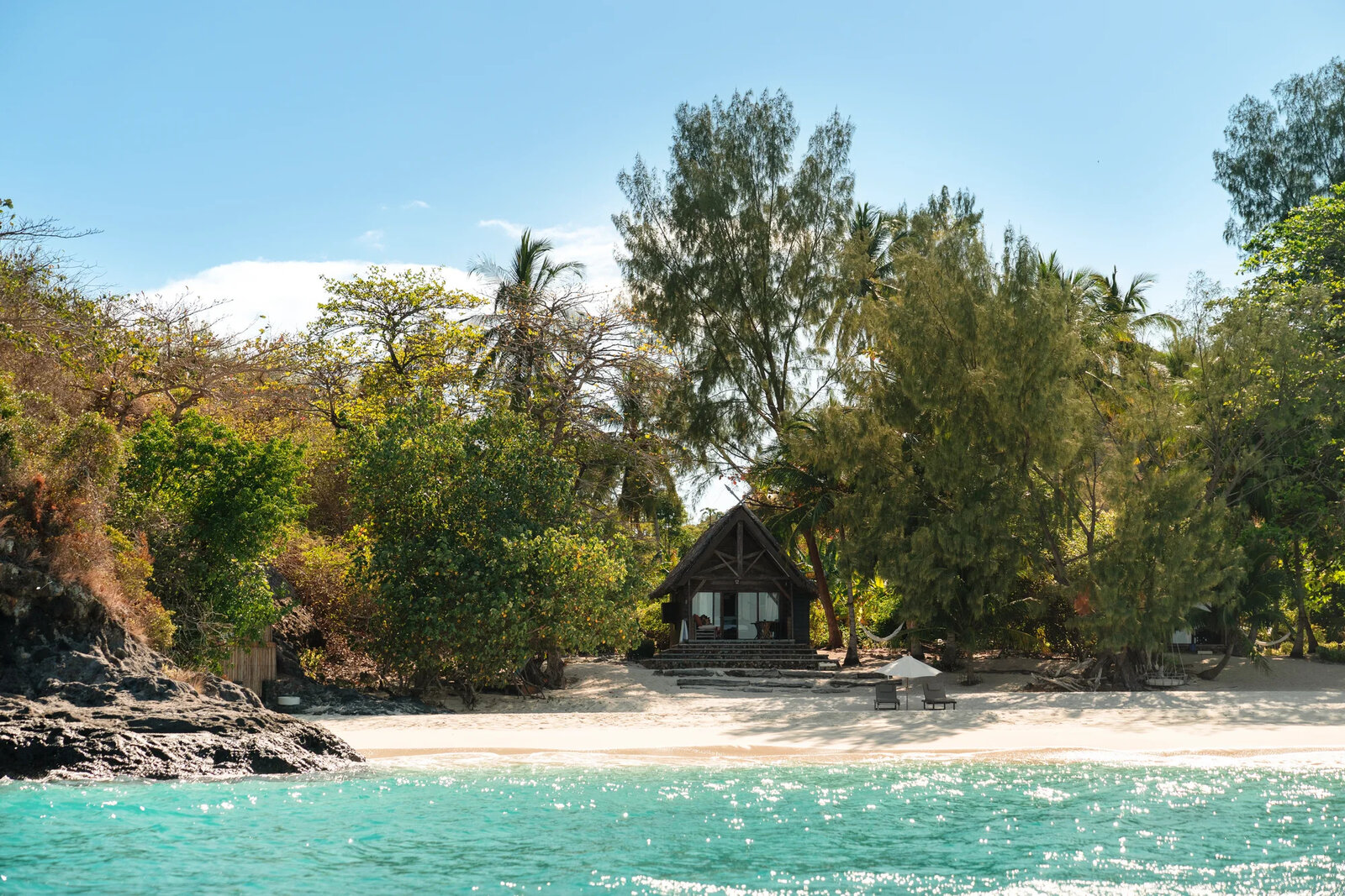 A thatched rosewood beachfront villa steps from the sand at Constance Tsarabanjina, Madagascar