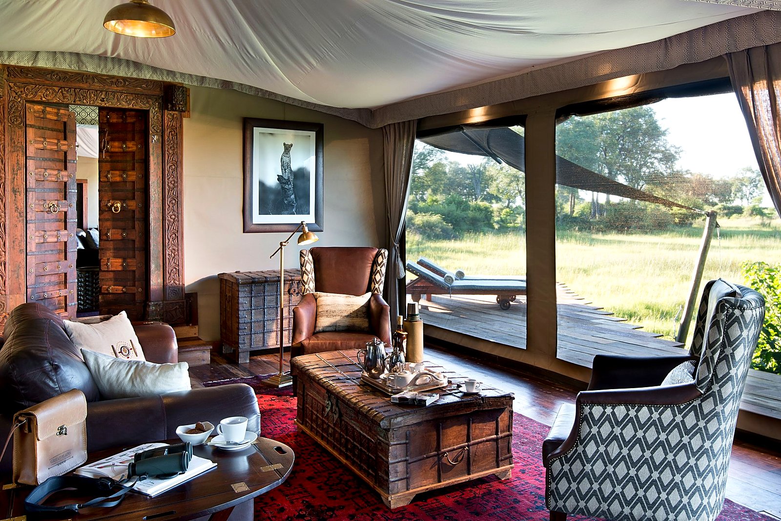 Open-fronted lounge at Duba Plains Camp gazing over the Okavango floodplains