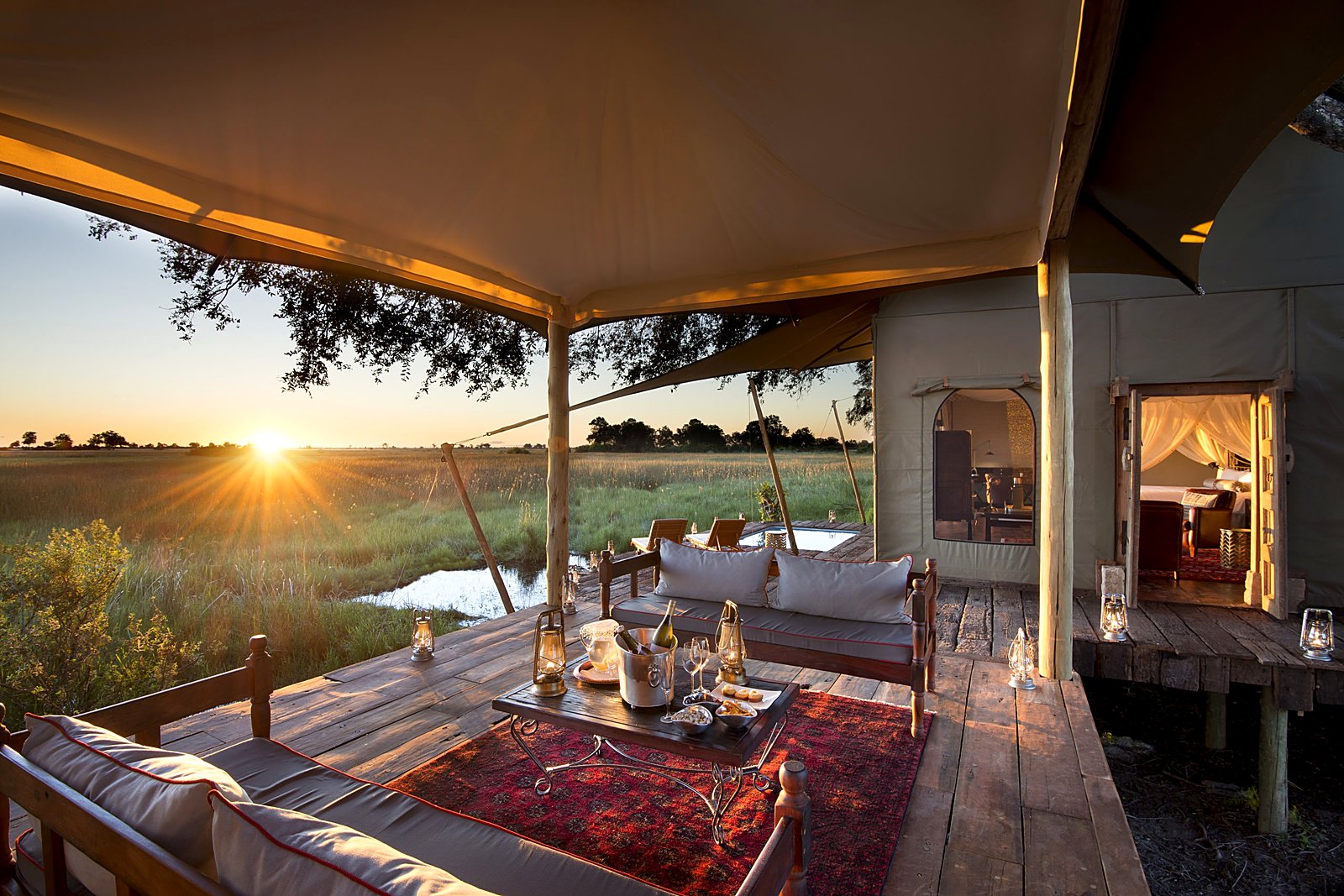 Sunset deck dining at Duba Plains Camp in the northern Okavango Delta