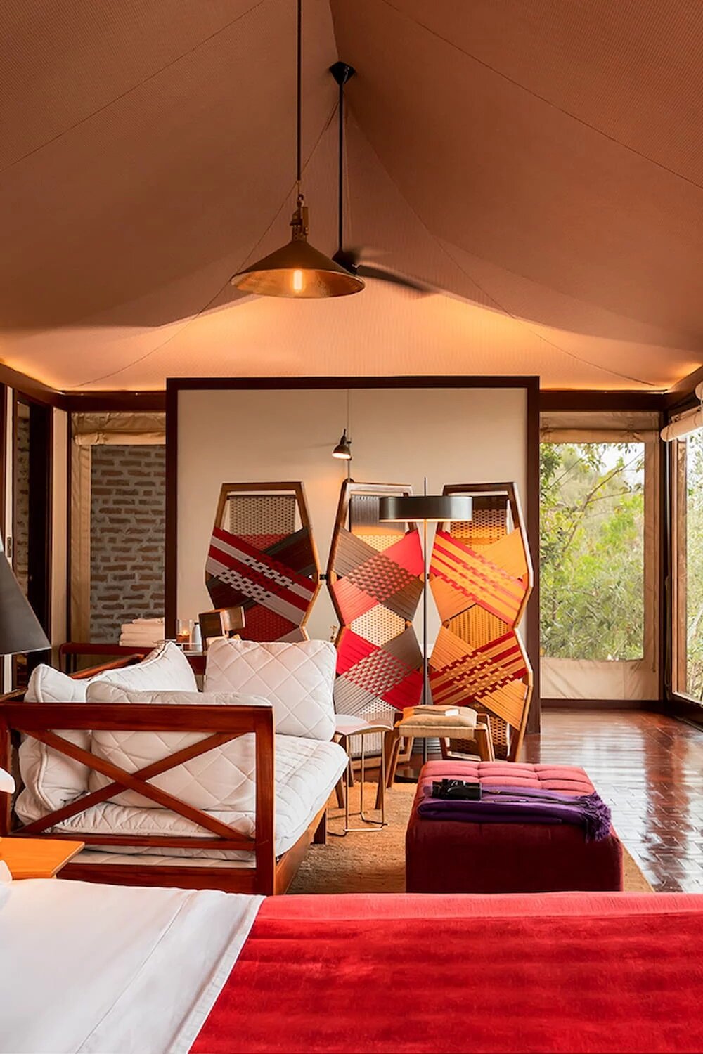 Angama Mara family tented suite with warm interiors on the Rift Valley rim