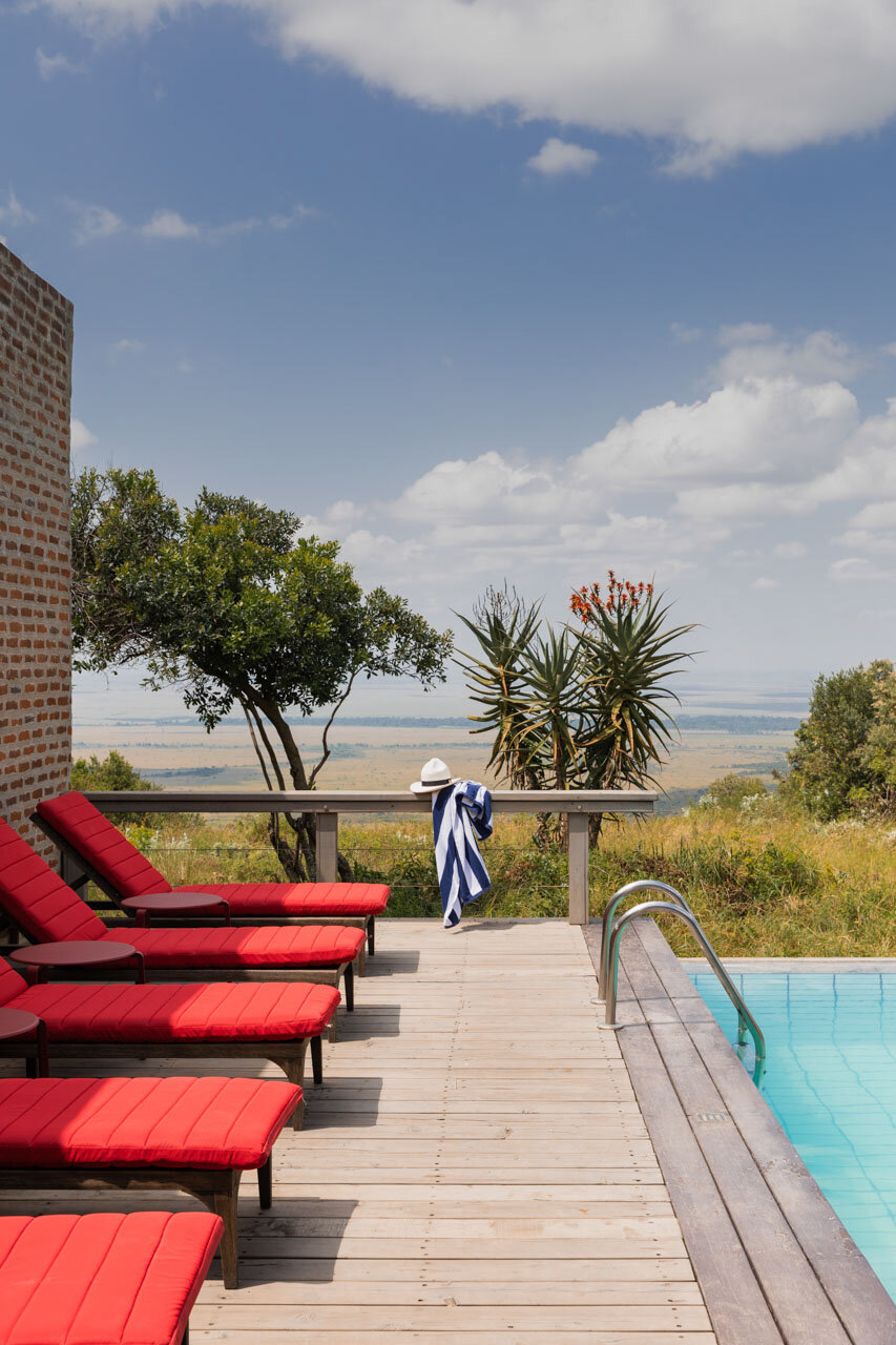 Angama Mara rim-flow pool and loungers overlooking the Masai Mara plains