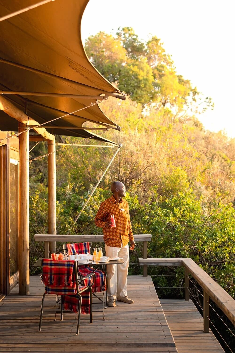 Private deck dining at Angama Mara with panoramic Mara views