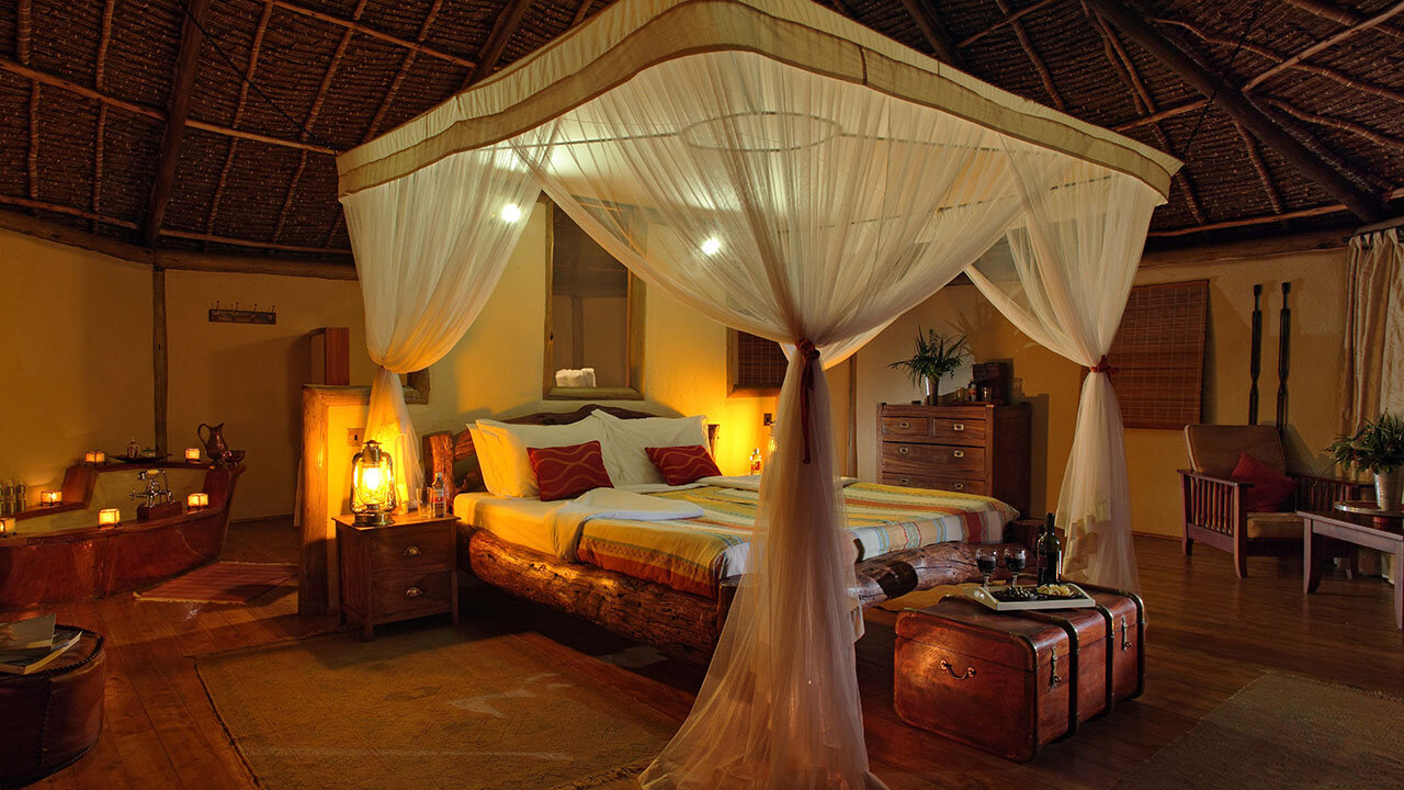 Tortilis Camp deck and tents in a private conservancy beside Amboseli